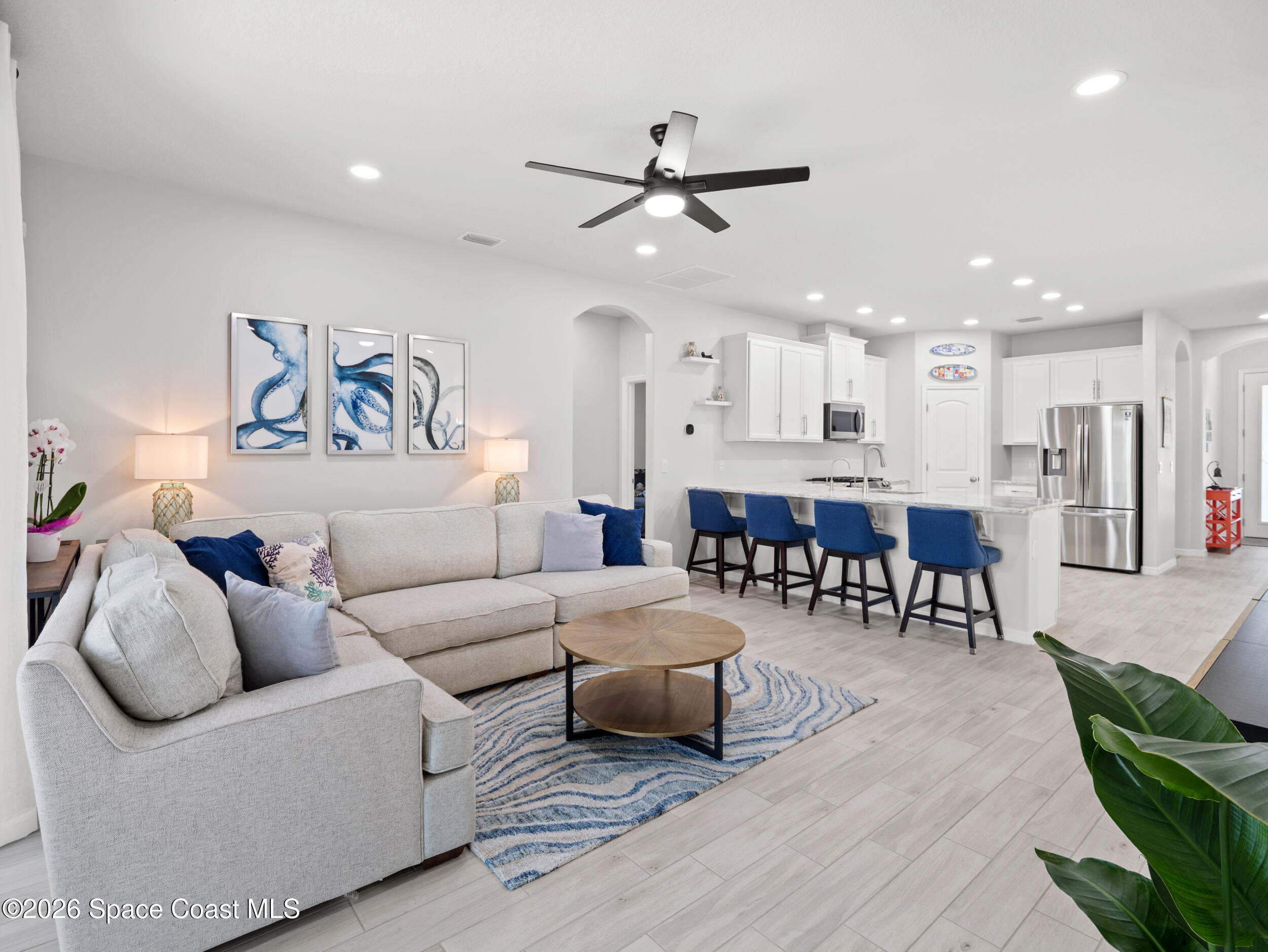 3363 Addison Drive Melbourne, FL 32940 - Photo 15 of 53 a living room with furniture and kitchen view