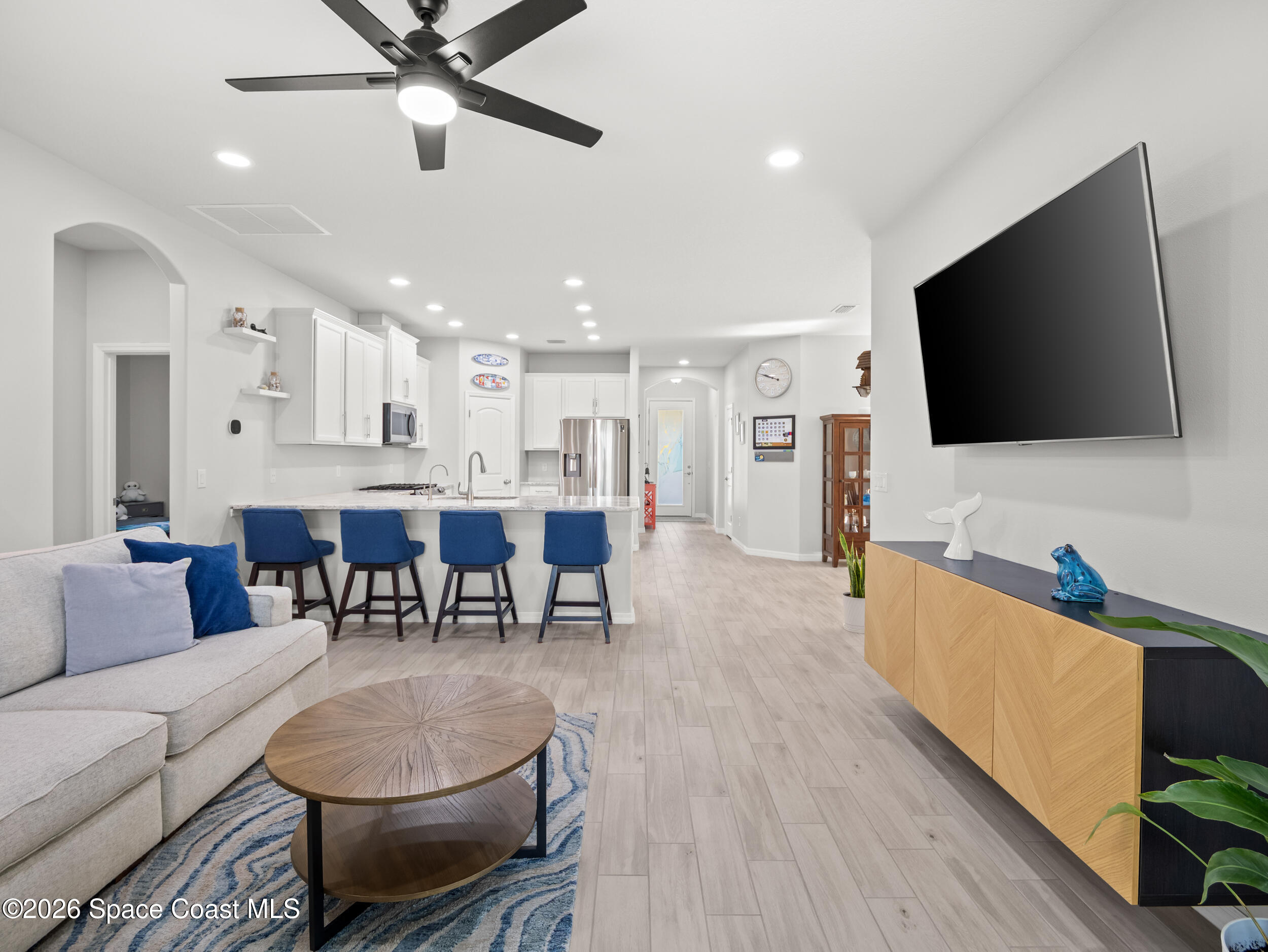 3363 Addison Drive Melbourne, FL 32940 - Photo 16 of 53 a living room with furniture and a flat screen tv