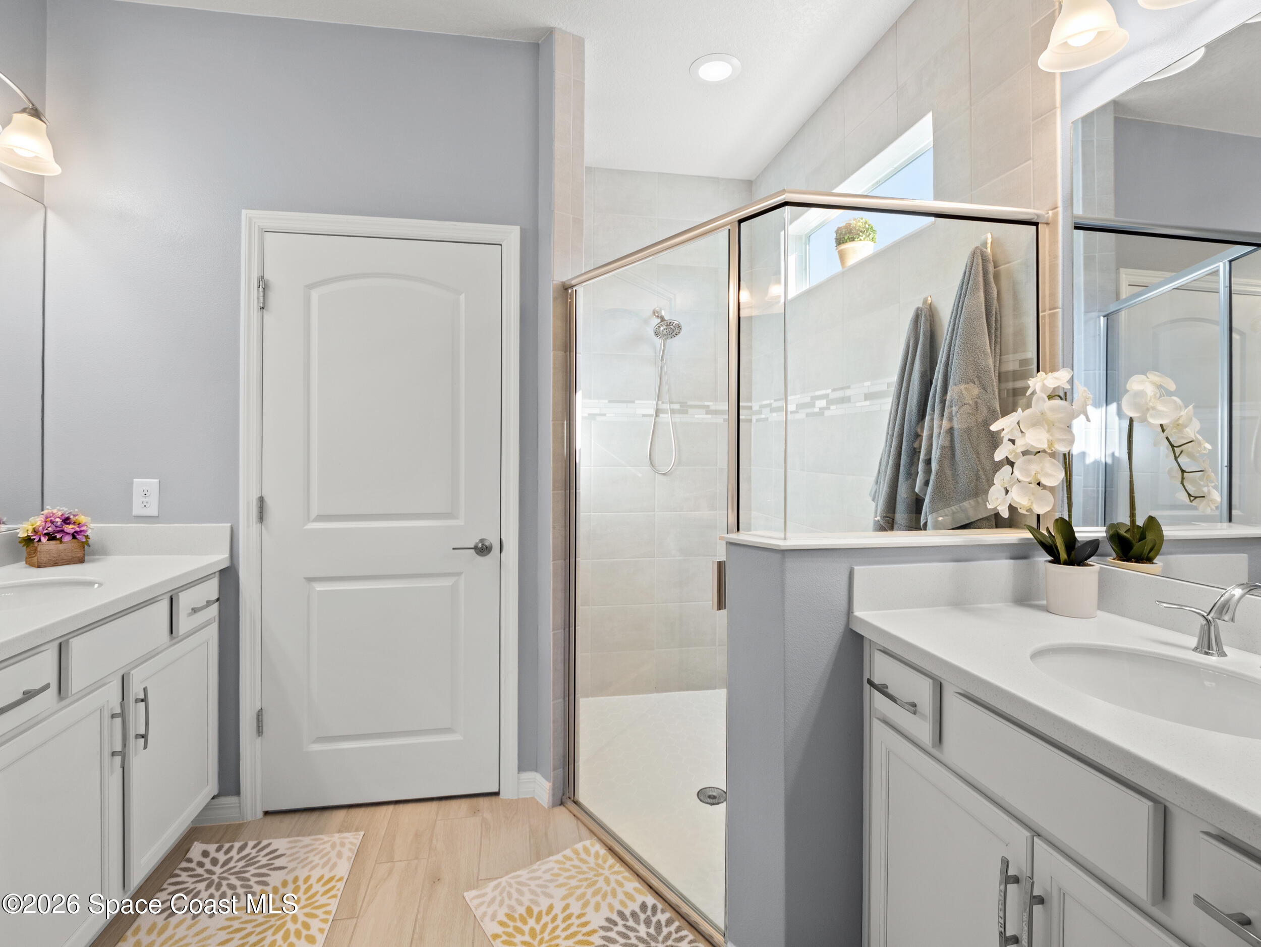 3363 Addison Drive Melbourne, FL 32940 - Photo 19 of 53 a bathroom with a sink and a mirror