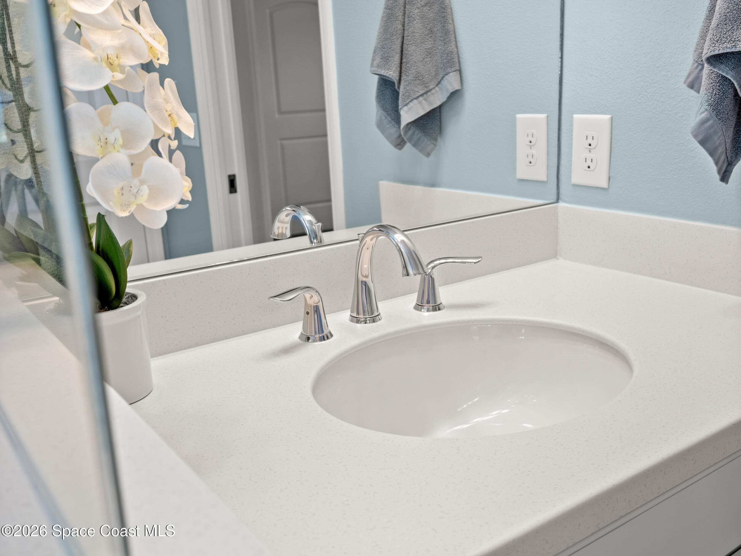 3363 Addison Drive Melbourne, FL 32940 - Photo 20 of 53 a bathroom with a sink and a mirror