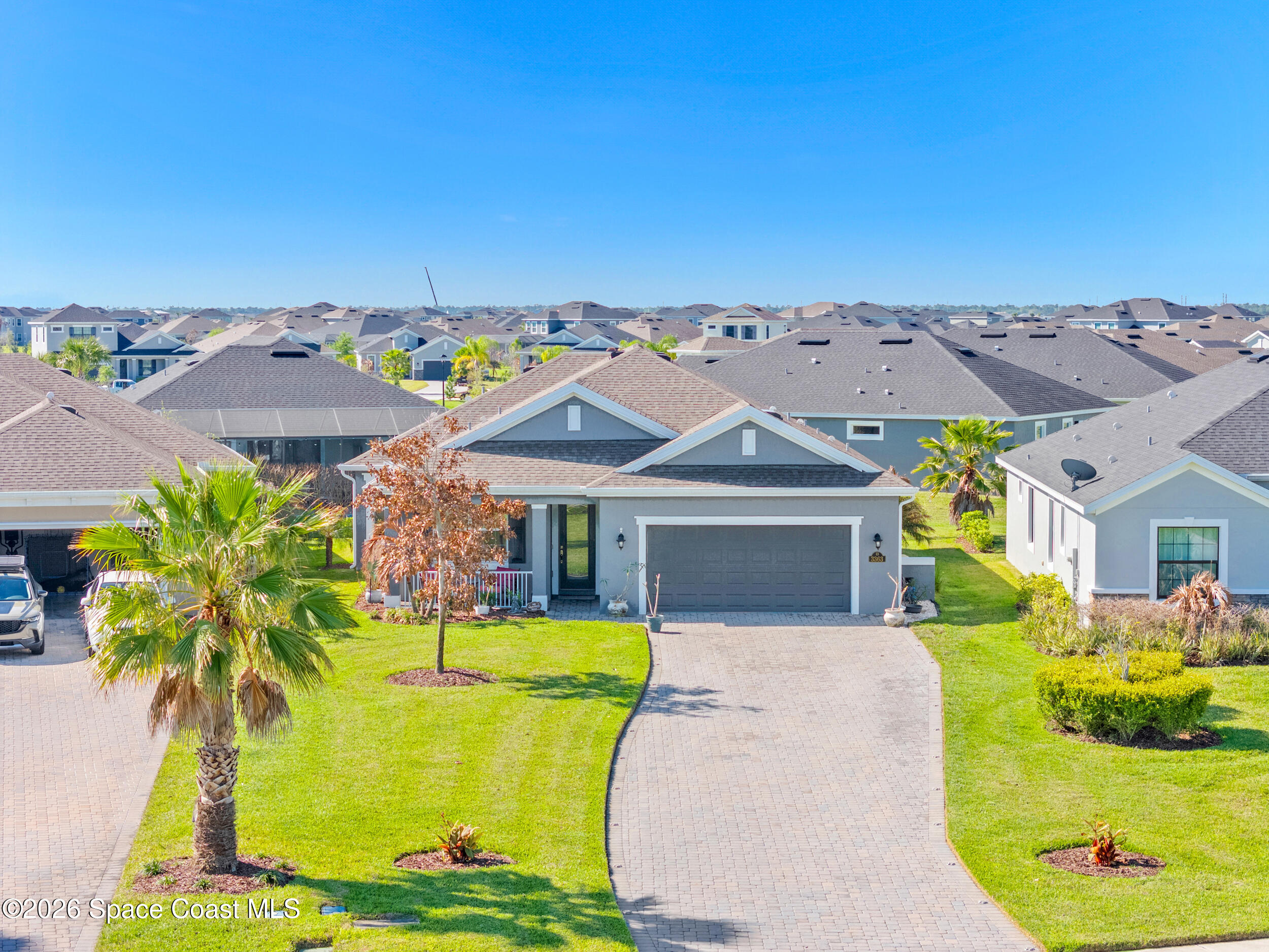 3363 Addison Drive Melbourne, FL 32940 - Photo 2 of 53 an aerial view of a house with a swimming pool