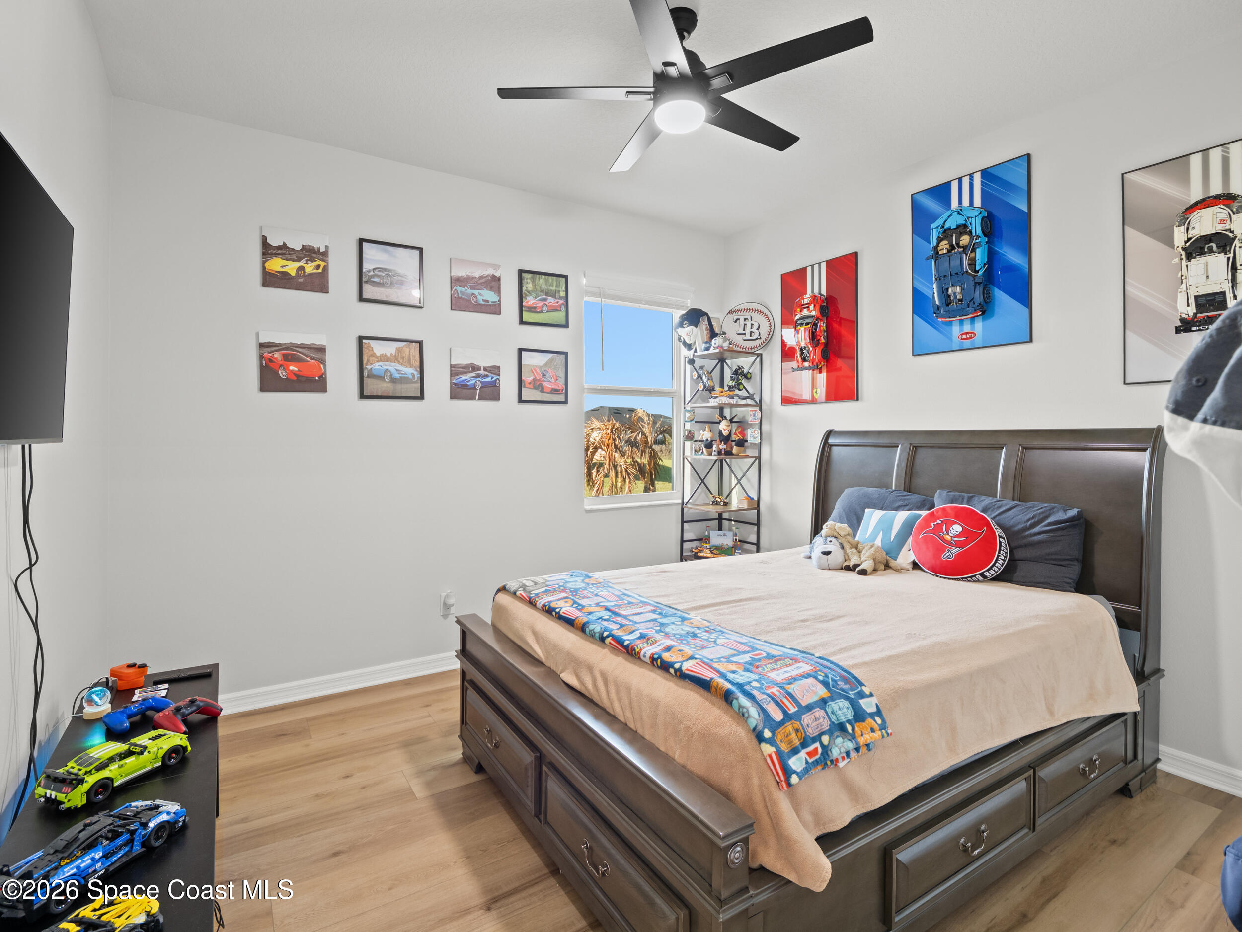 3363 Addison Drive Melbourne, FL 32940 - Photo 25 of 53 a bedroom with a bed and dresser