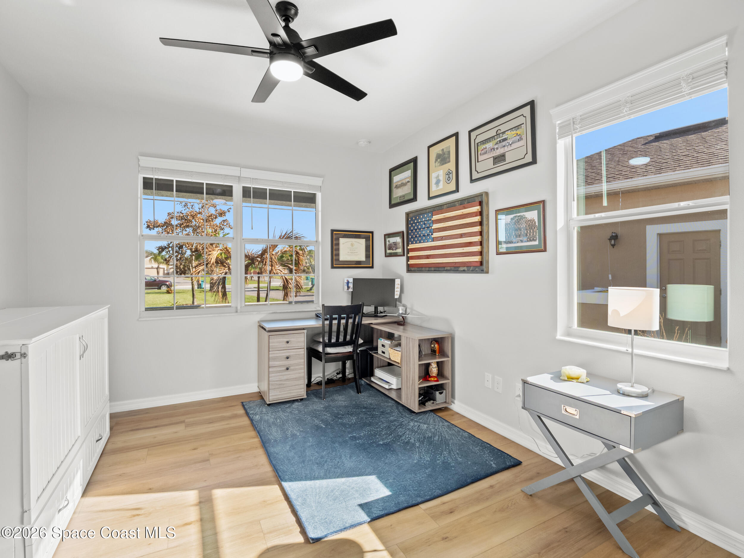 3363 Addison Drive Melbourne, FL 32940 - Photo 27 of 53 a living room with stainless steel appliances kitchen island granite countertop furniture and a rug