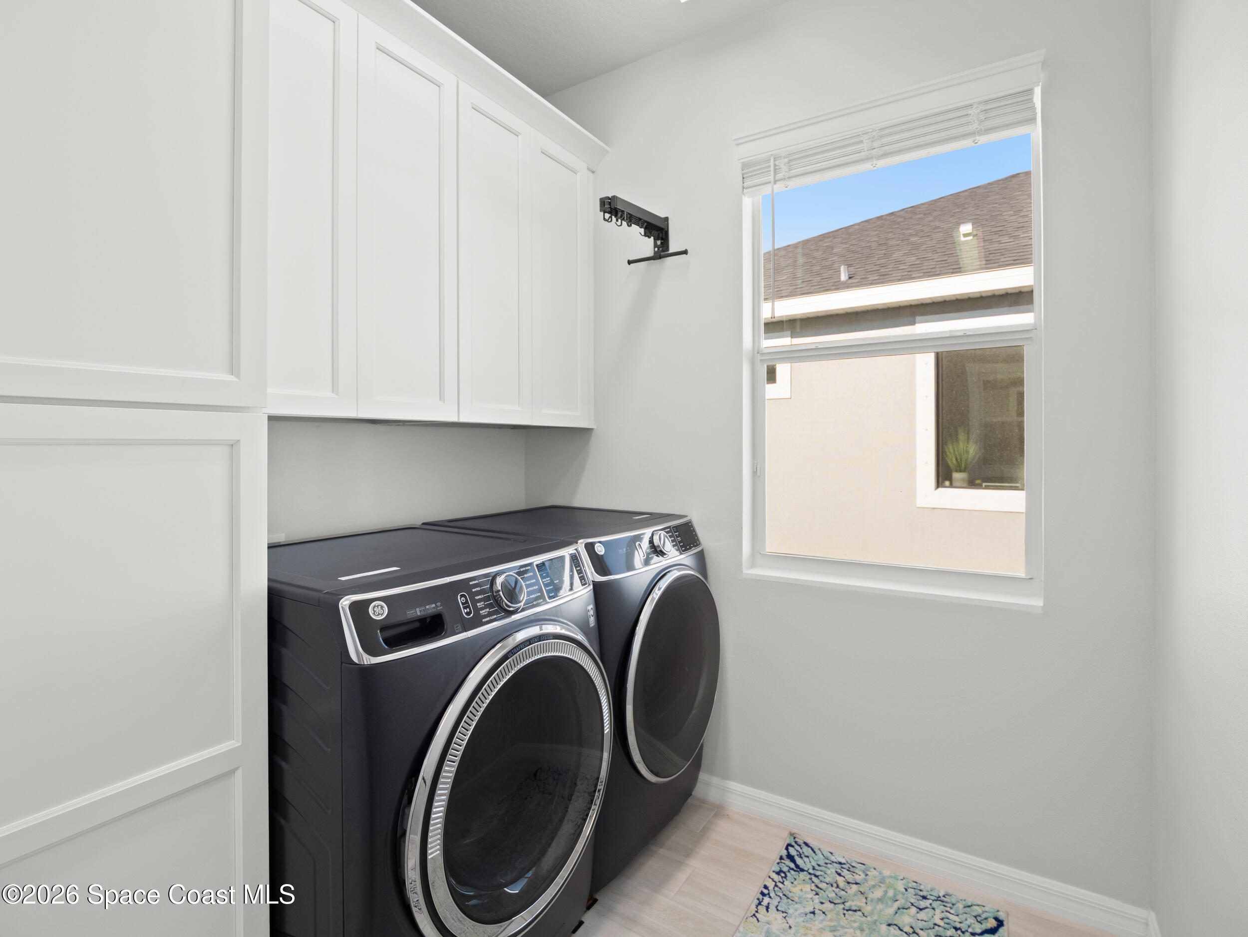 3363 Addison Drive Melbourne, FL 32940 - Photo 30 of 53 a utility room with dryer and washer