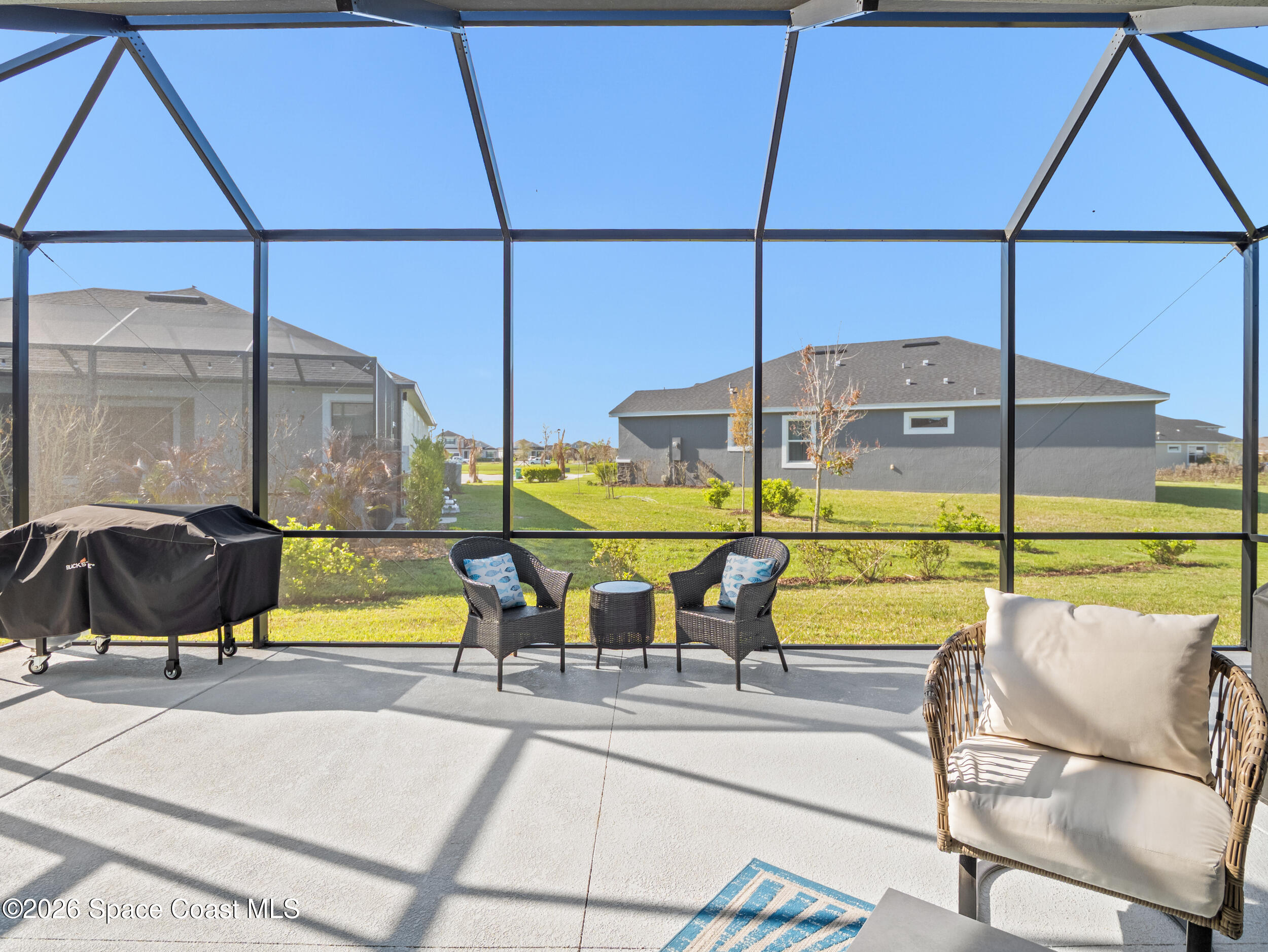 3363 Addison Drive Melbourne, FL 32940 - Photo 33 of 53 a view of a swimming pool with a lounge chair