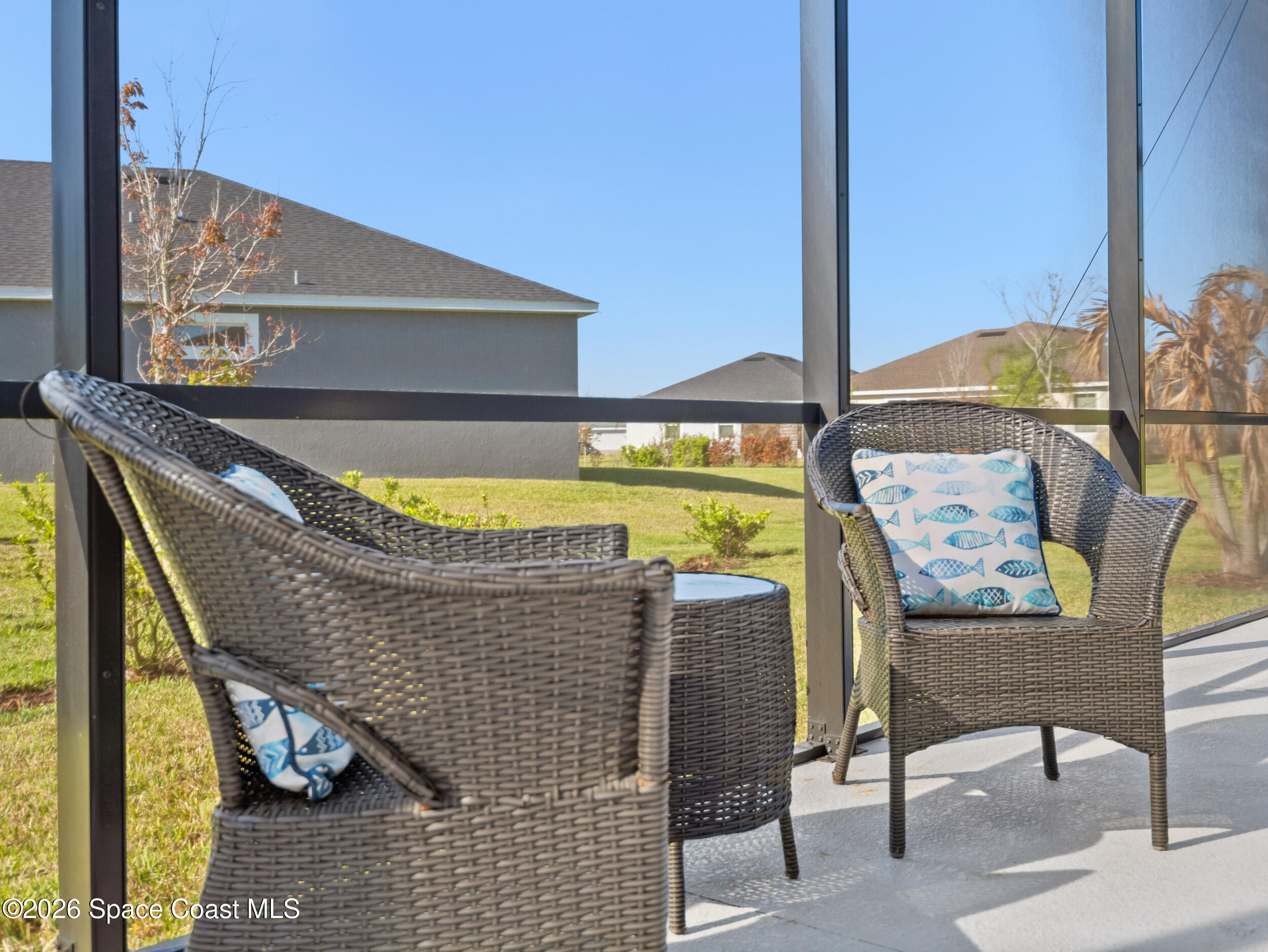 3363 Addison Drive Melbourne, FL 32940 - Photo 34 of 53 a balcony with table and chairs