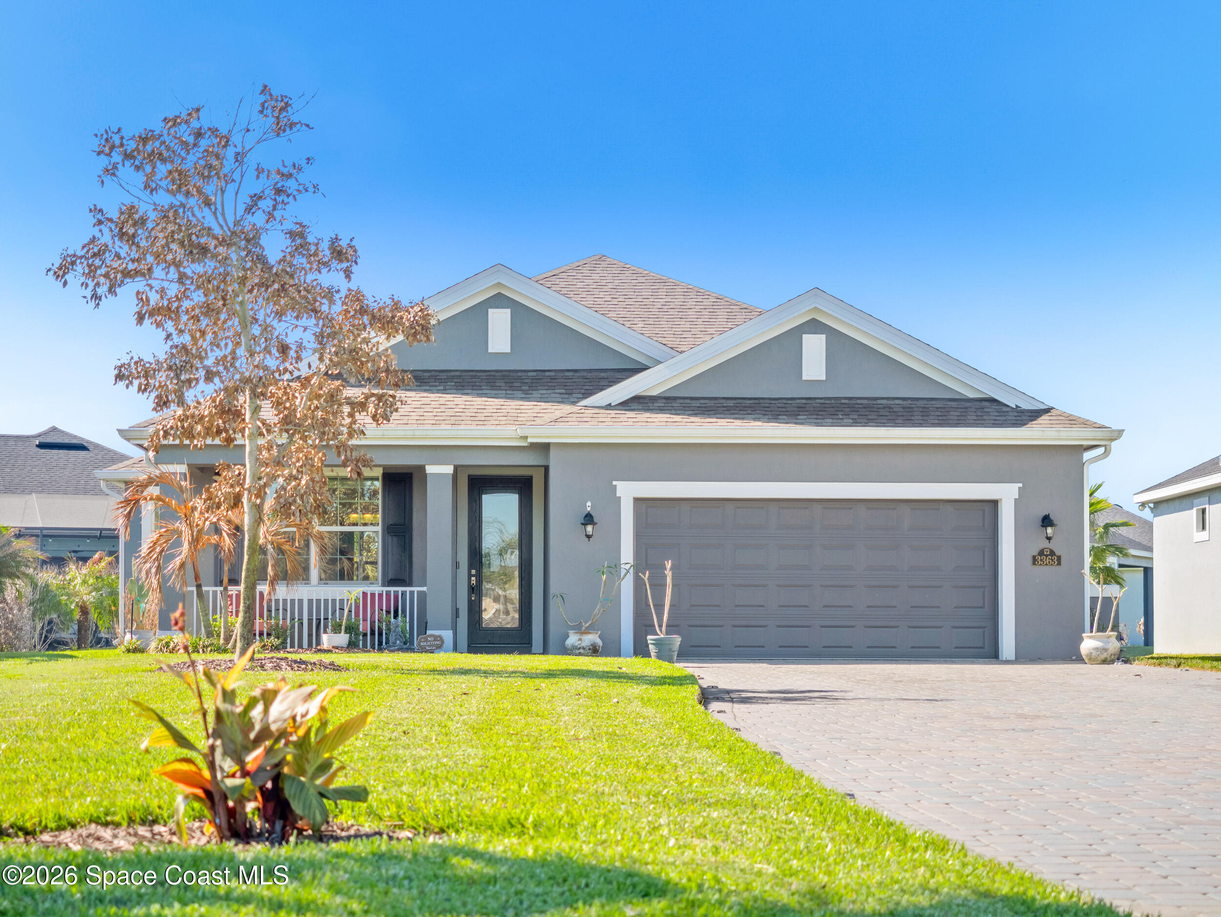 3363 Addison Drive Melbourne, FL 32940 - Photo 39 of 53 a front view of a house with a yard