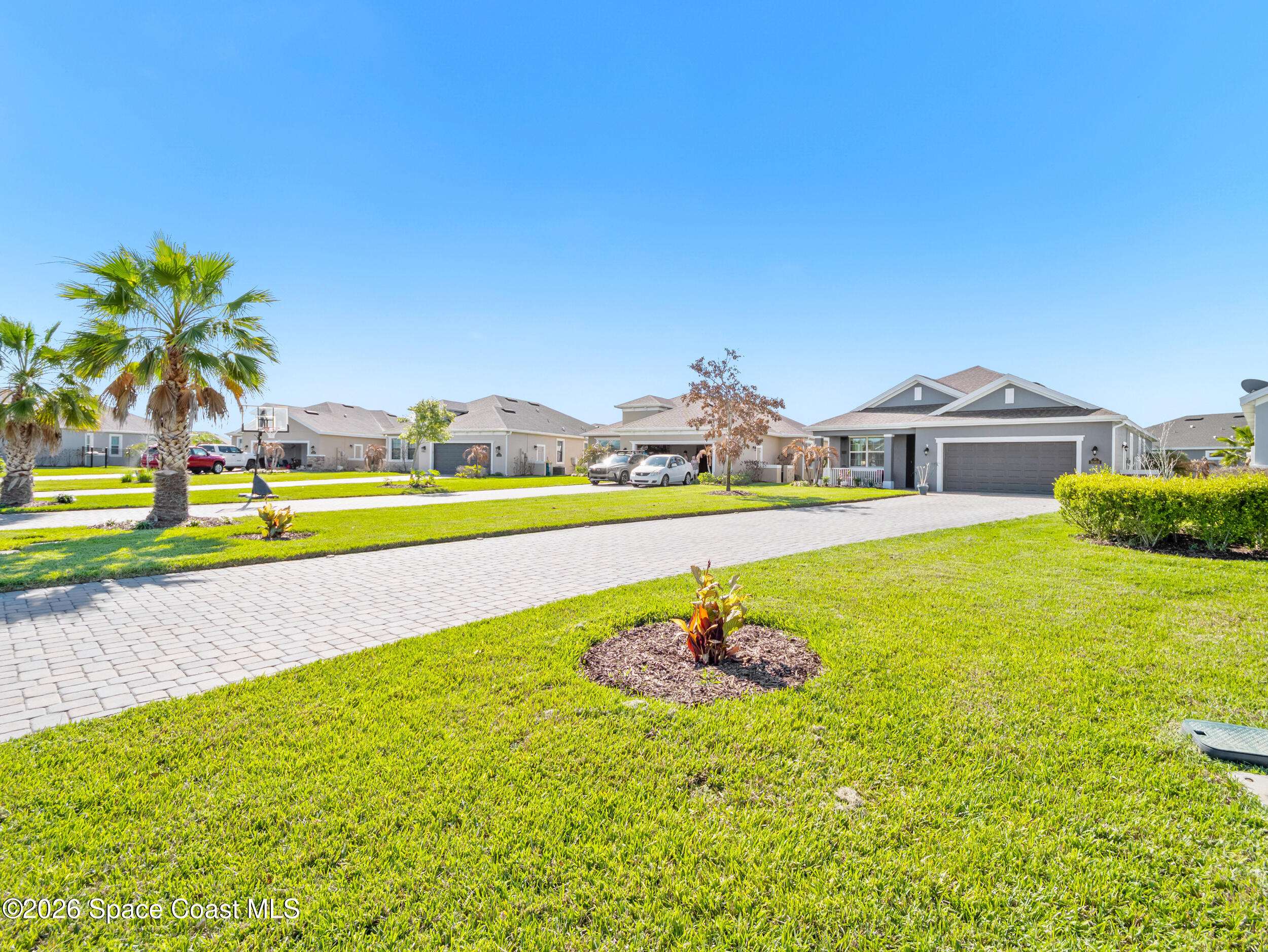 3363 Addison Drive Melbourne, FL 32940 - Photo 40 of 53 a view of a swimming pool with an outdoor space and seating area