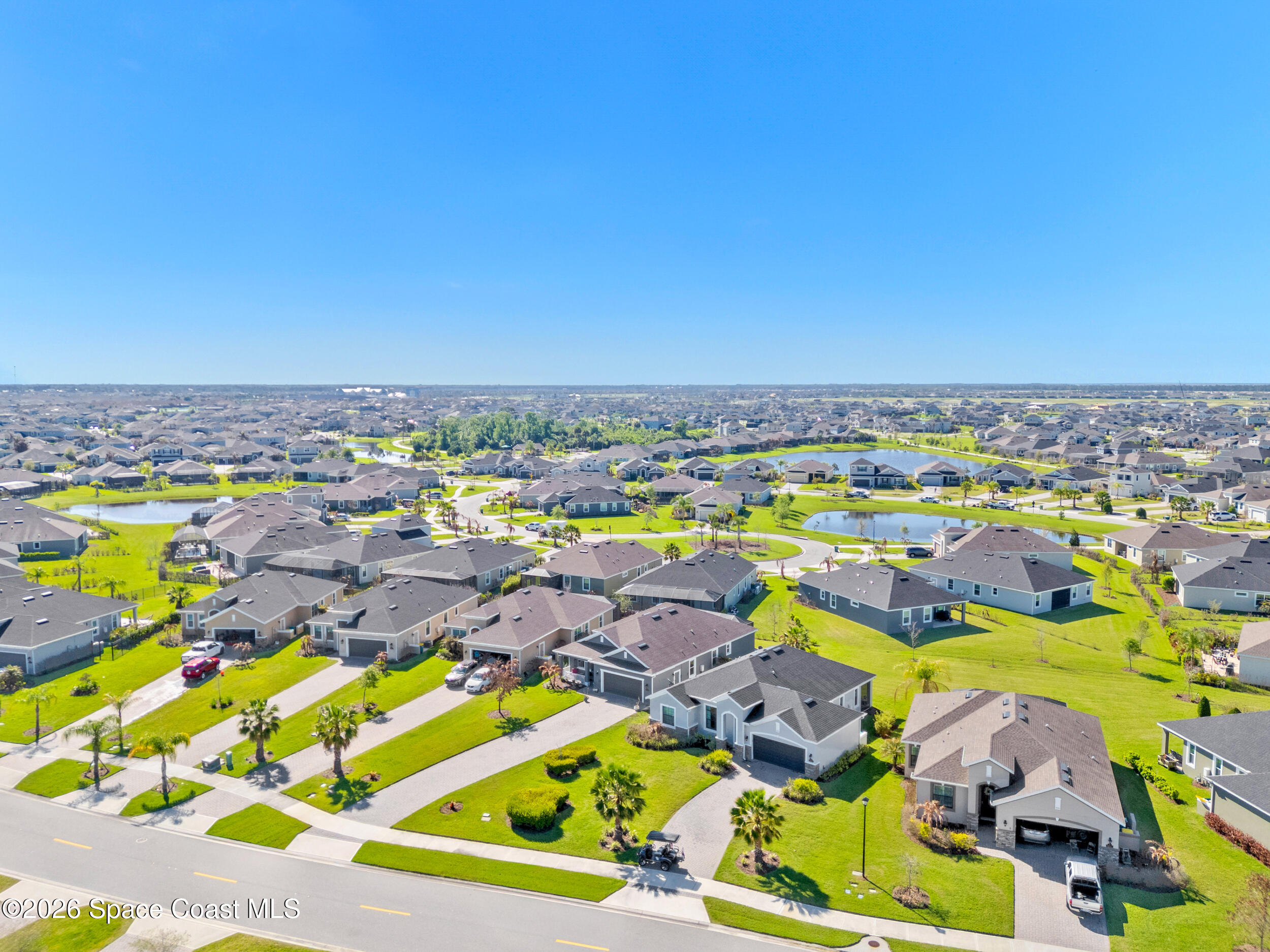 3363 Addison Drive Melbourne, FL 32940 - Photo 43 of 53 an aerial view of residential houses with outdoor space
