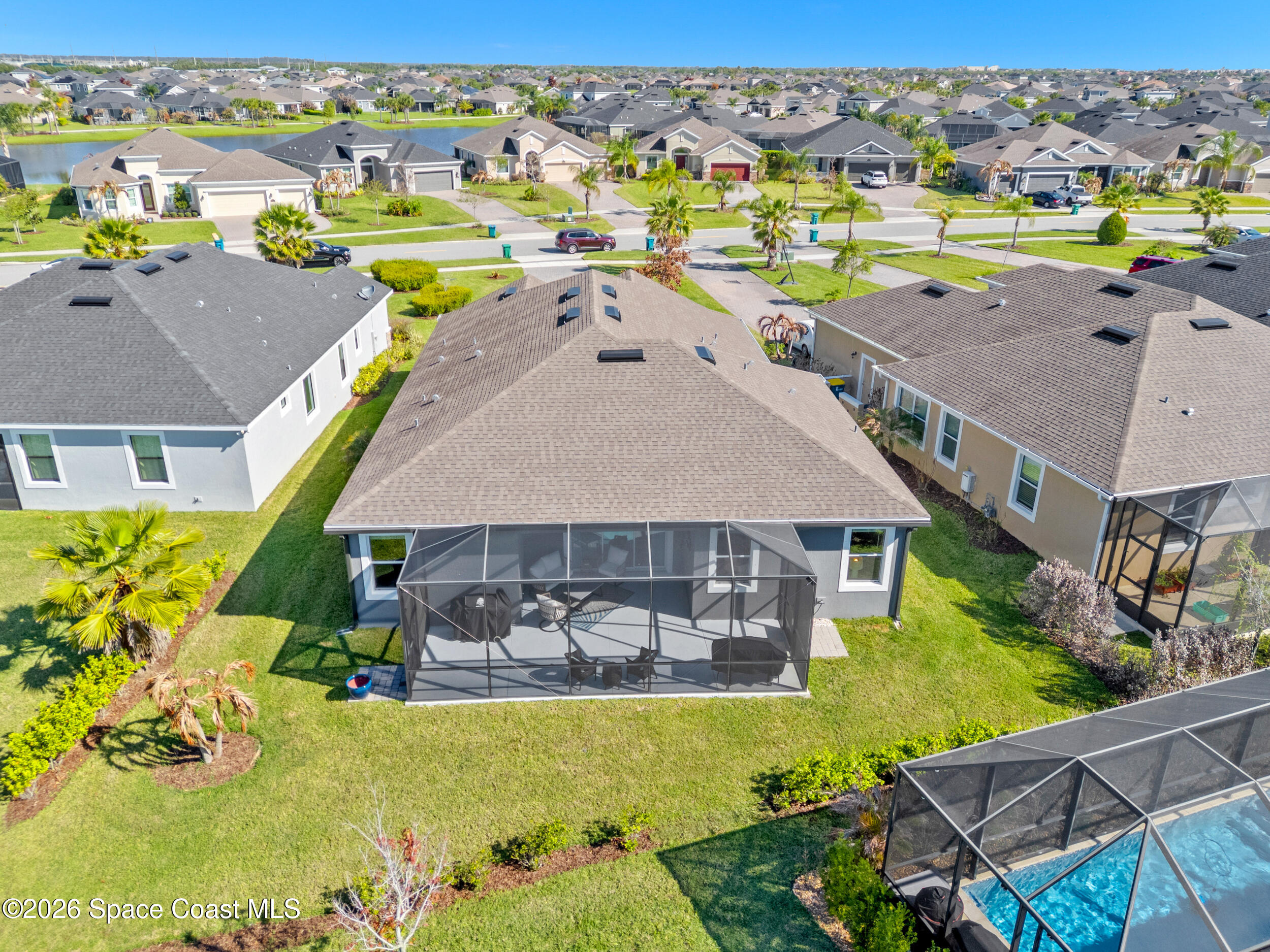 3363 Addison Drive Melbourne, FL 32940 - Photo 47 of 53 an aerial view of a house with a swimming pool yard and outdoor seating