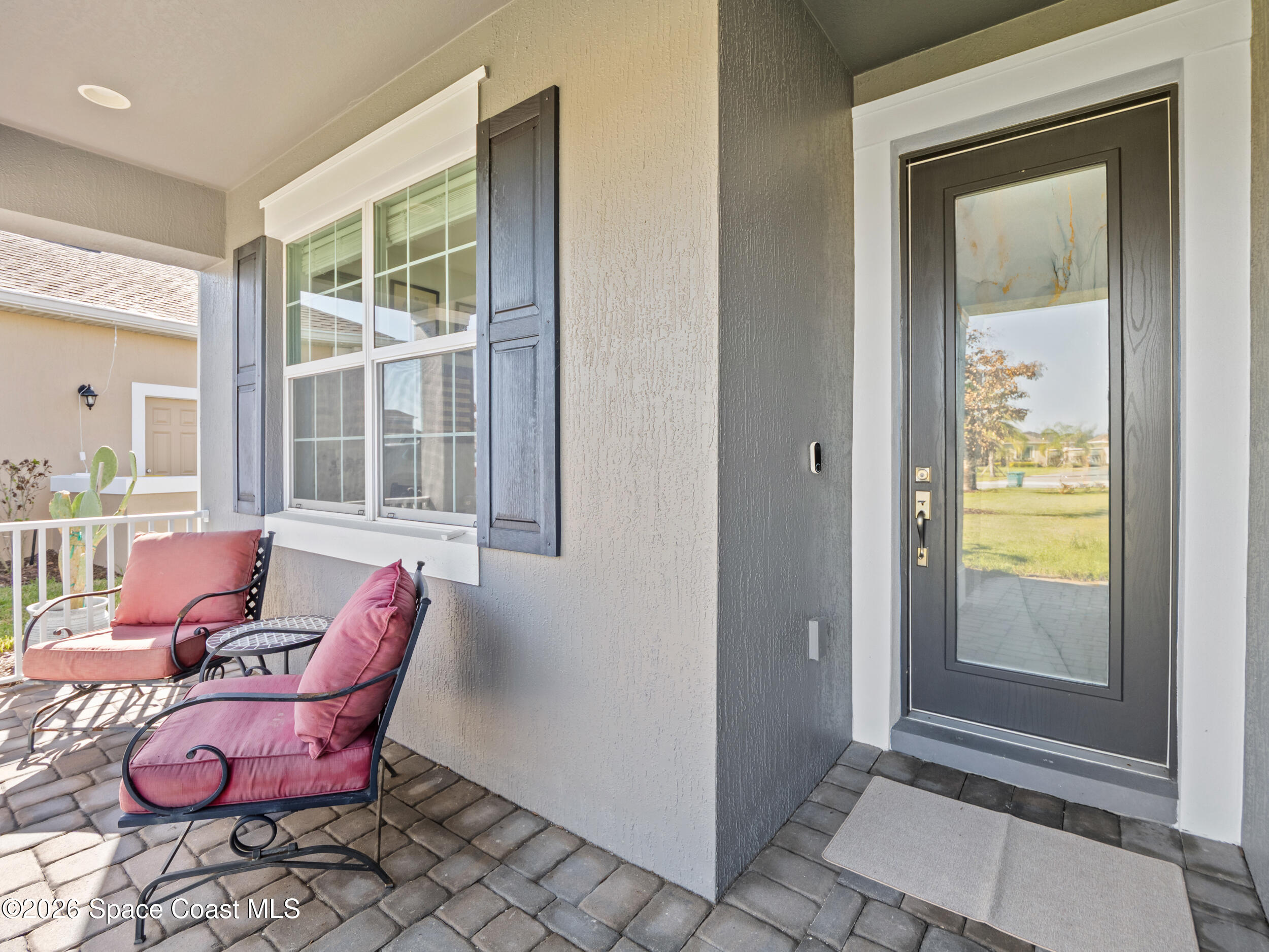 3363 Addison Drive Melbourne, FL 32940 - Photo 49 of 53 a living room with furniture and a window
