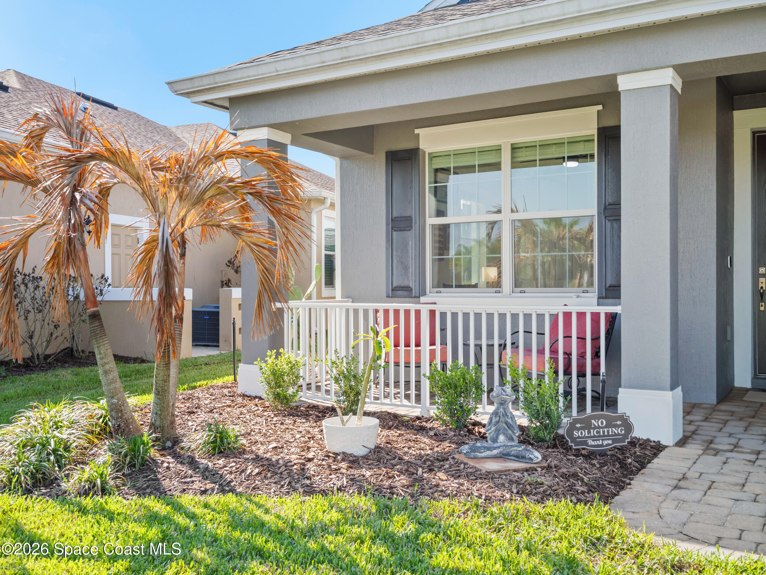 3363 Addison Drive Melbourne, FL 32940 - Photo 50 of 53 a view of a house with a small yard and plants