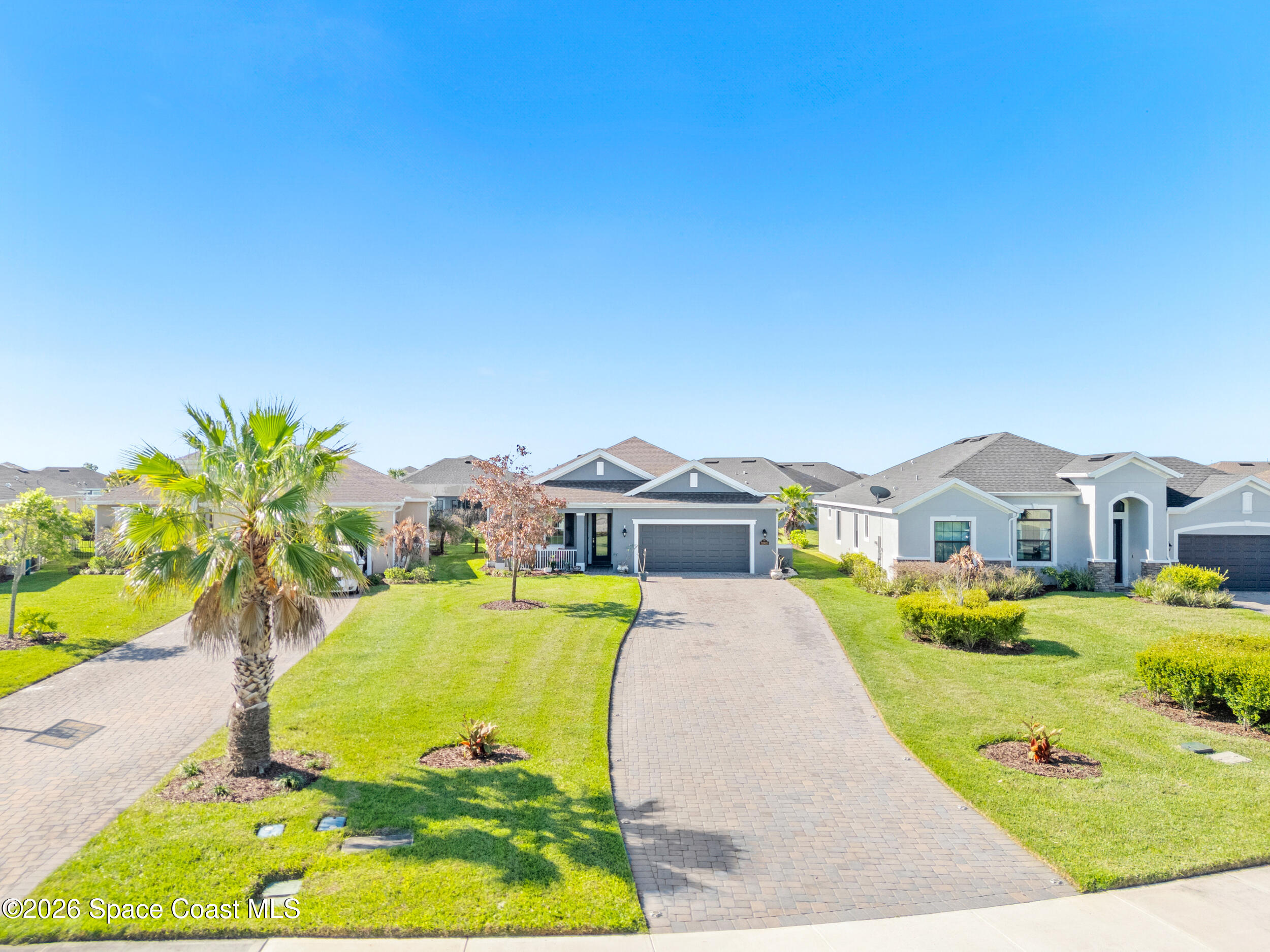 3363 Addison Drive Melbourne, FL 32940 - Photo 52 of 53 a view of a house with a swimming pool