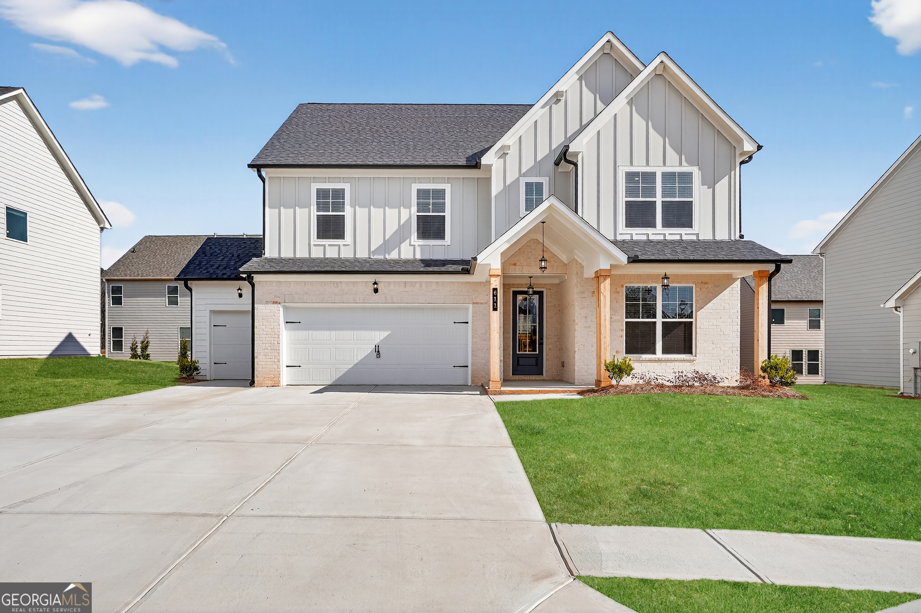 a front view of a house with a yard