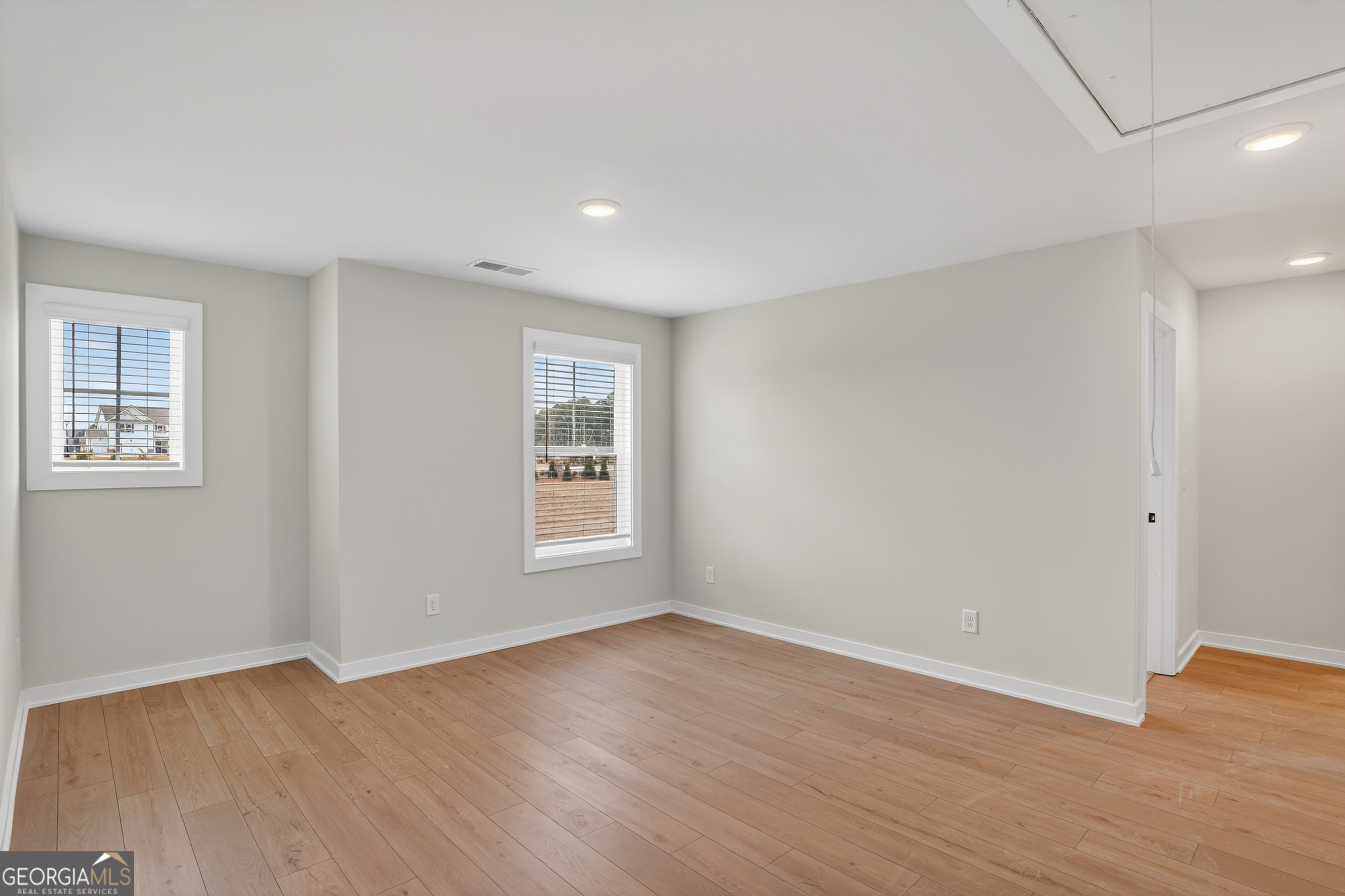 611 Villa Rica Springs Villa Rica, GA 30180 - Photo 18 of 35 a view of an empty room with wooden floor and a window