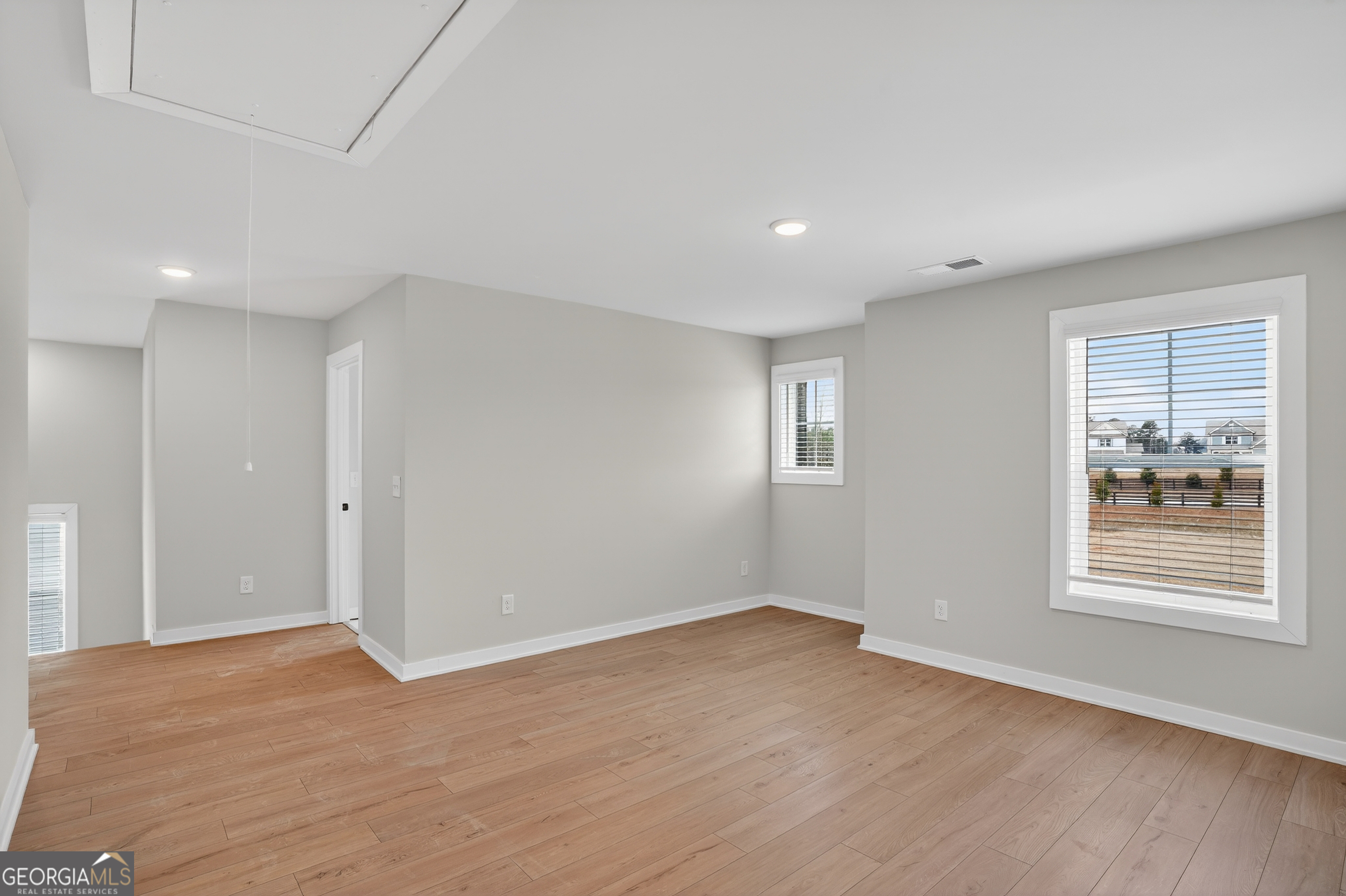 611 Villa Rica Springs Villa Rica, GA 30180 - Photo 19 of 35 a view of an empty room with wooden floor and a window
