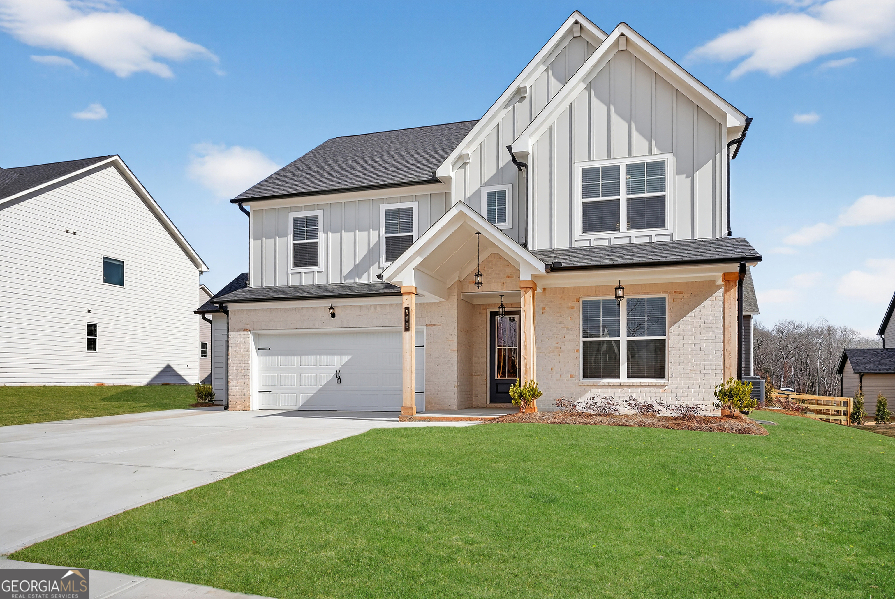 611 Villa Rica Springs Villa Rica, GA 30180 - Photo 2 of 35 a view of a white house with yard and plants