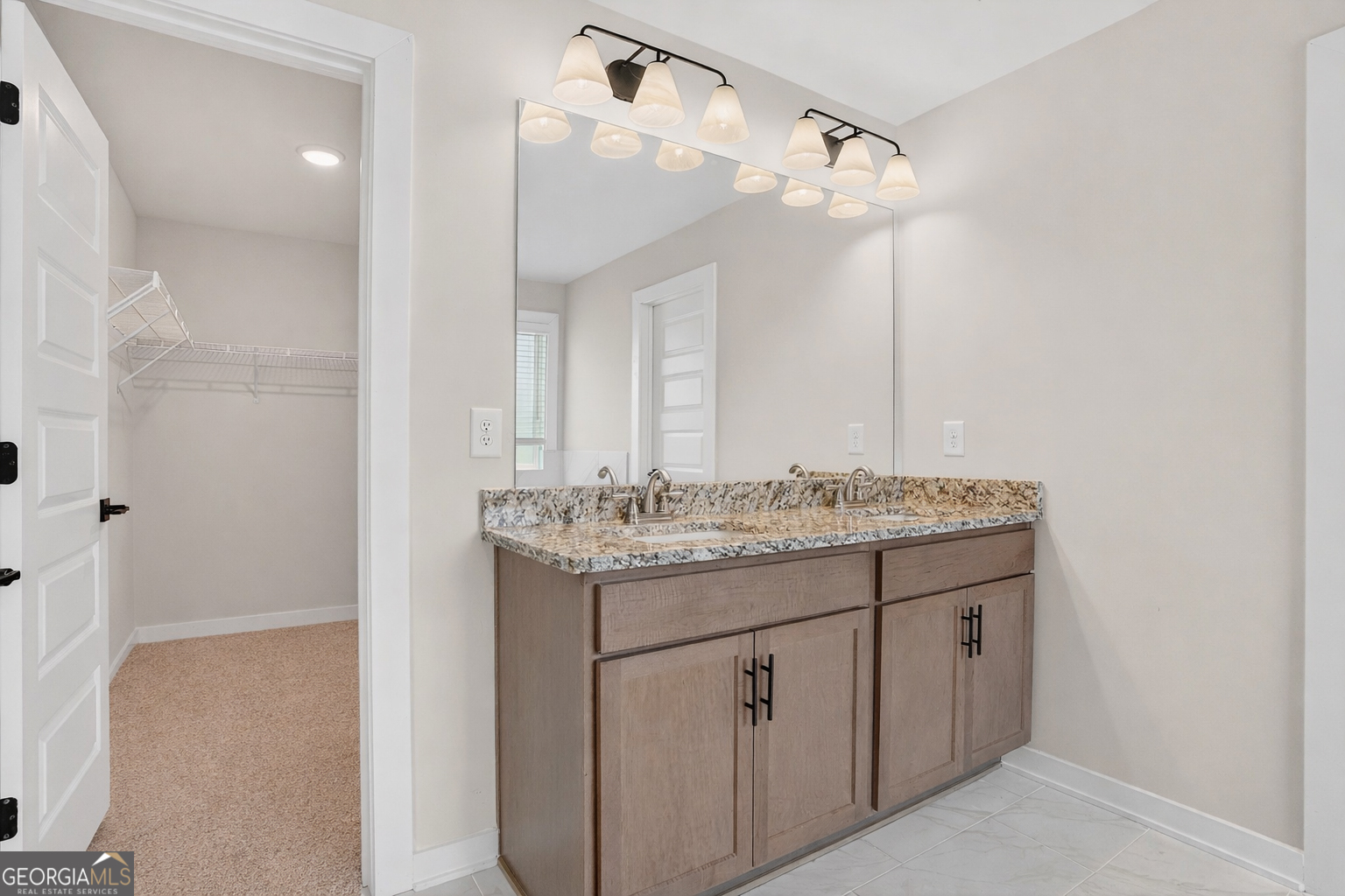 611 Villa Rica Springs Villa Rica, GA 30180 - Photo 25 of 35 a bathroom with a granite countertop sink a light fixture and a mirror