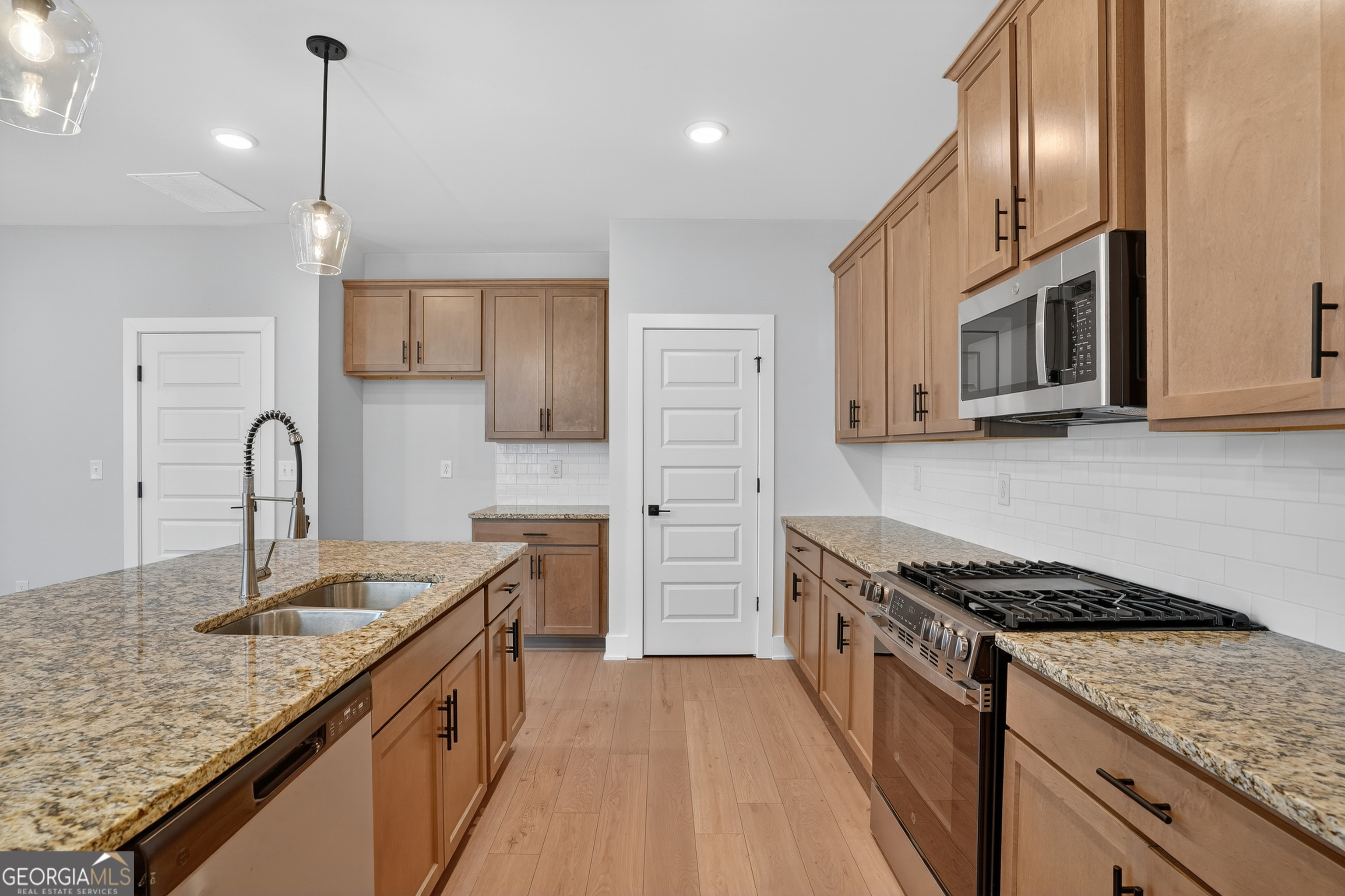 611 Villa Rica Springs Villa Rica, GA 30180 - Photo 8 of 35 a kitchen with stainless steel appliances granite countertop a sink stove and refrigerator