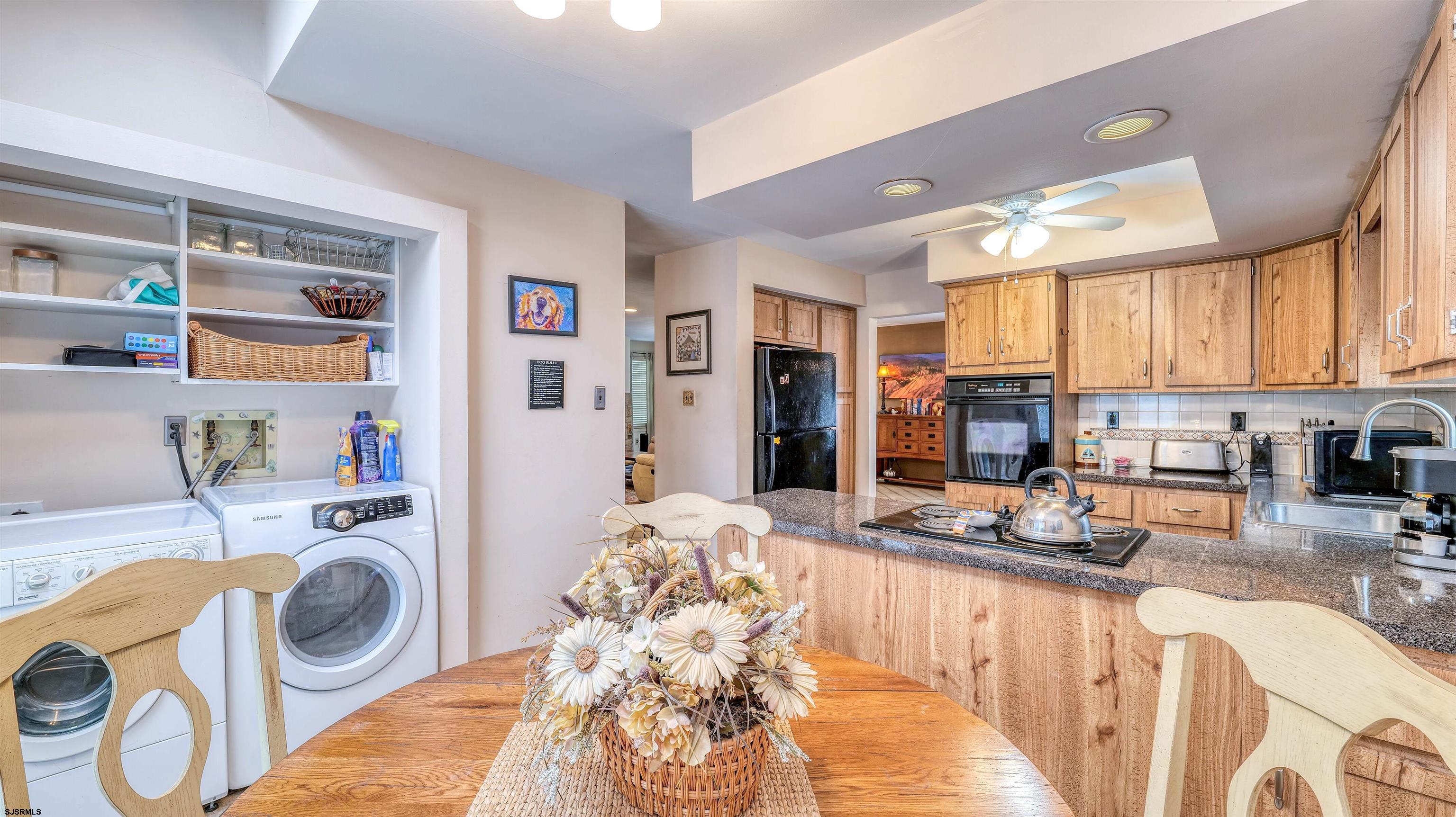 1330 Ouimet Road Brigantine, NJ 08203 - Photo 12 of 43 a kitchen with granite countertop a sink stove and refrigerator