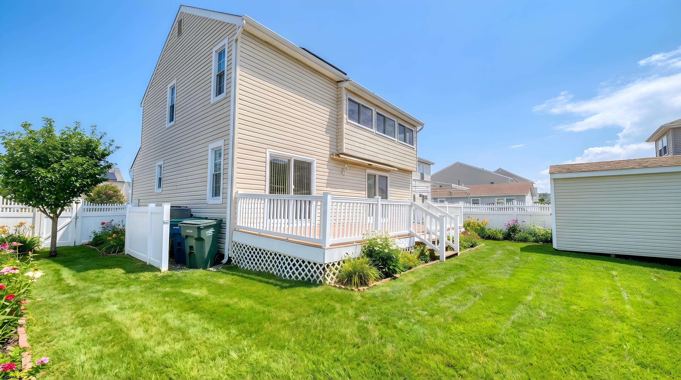 1330 Ouimet Road Brigantine, NJ 08203 - Photo 2 of 43 a view of a house with a yard and plants