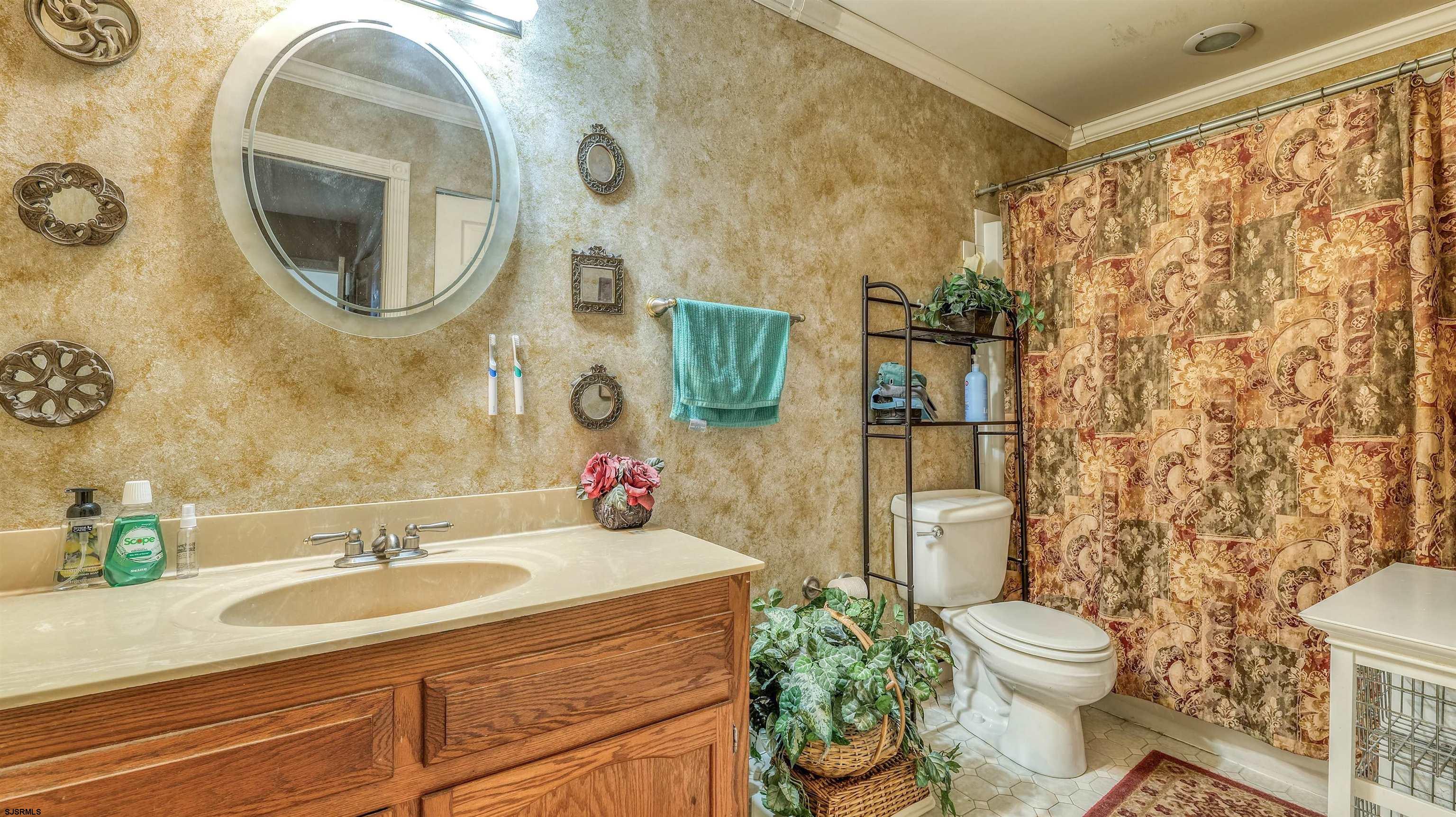 1330 Ouimet Road Brigantine, NJ 08203 - Photo 21 of 43 a bathroom with a sink and a mirror