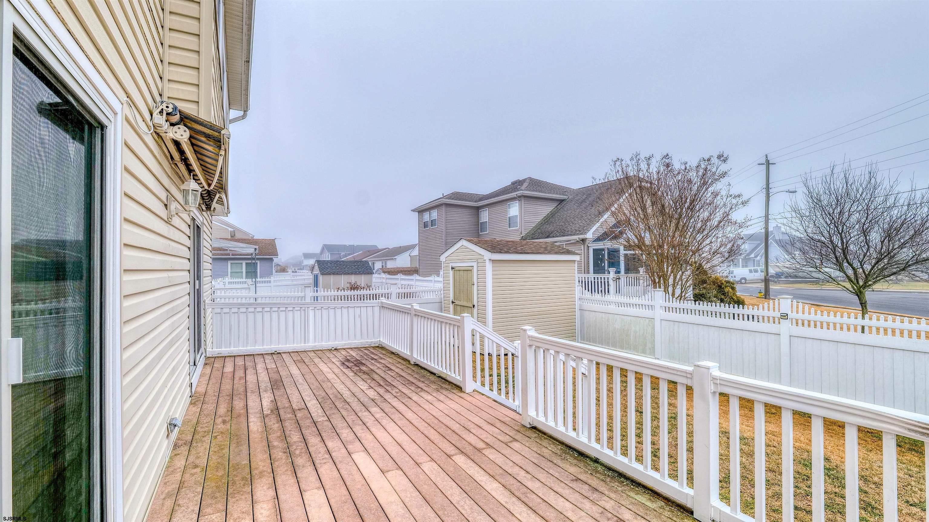 1330 Ouimet Road Brigantine, NJ 08203 - Photo 26 of 43 a view of a balcony with wooden floor