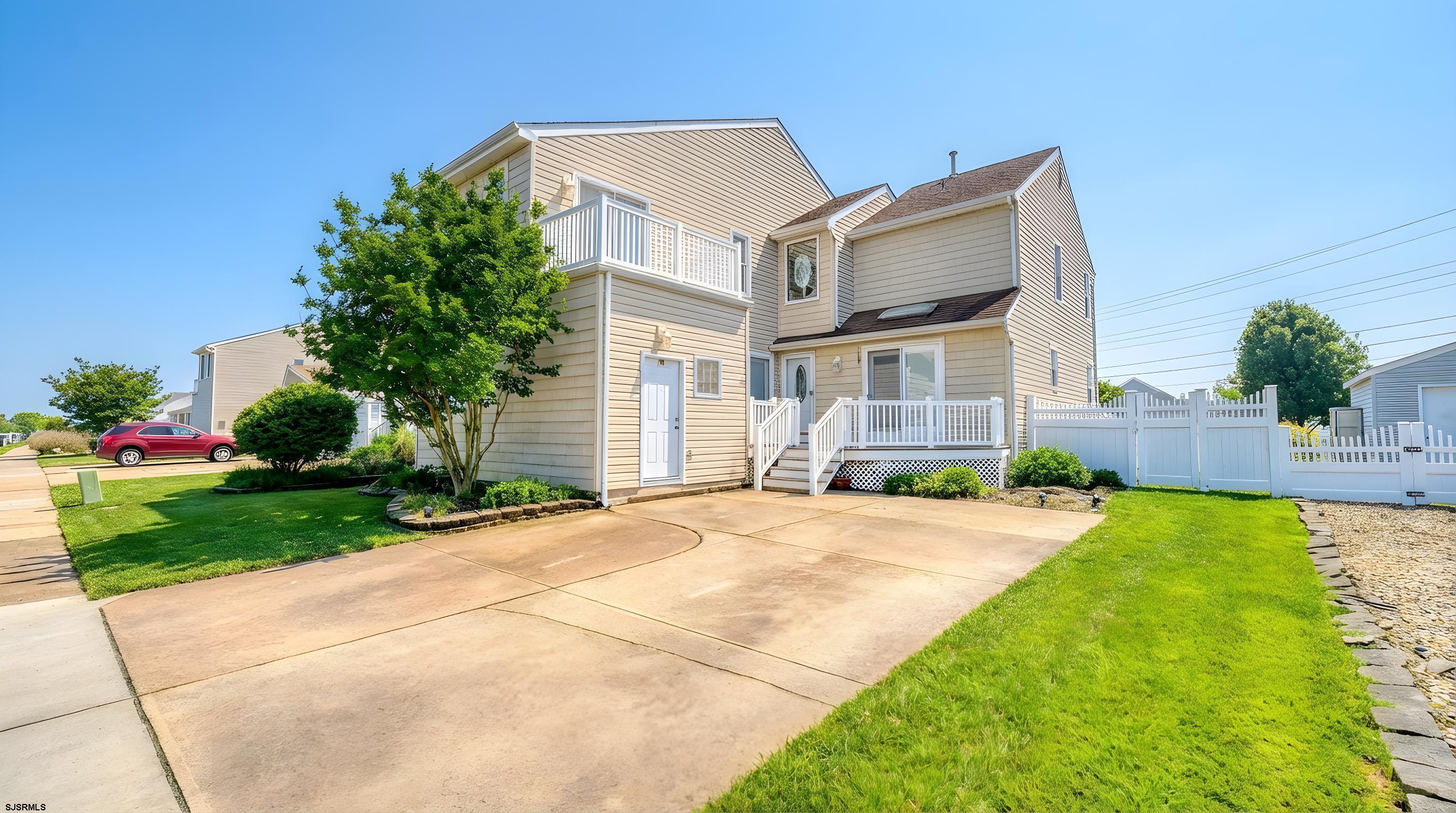 1330 Ouimet Road Brigantine, NJ 08203 - Photo 27 of 43 a front view of a house with yard and green space