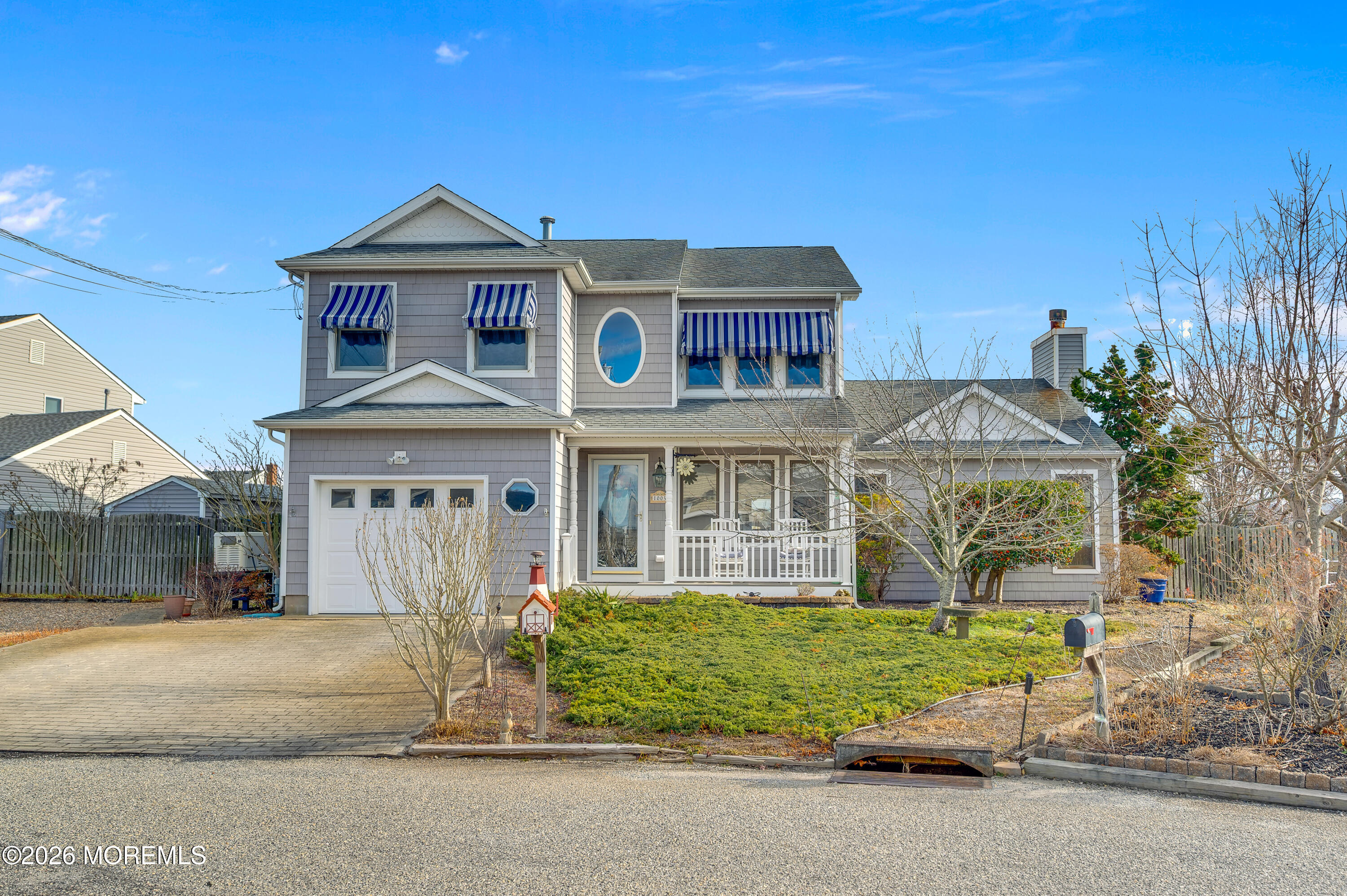 1005 Plimsoll Point Lanoka Harbor, NJ 08734 - Photo 19 of 54 a front view of a house with a garden