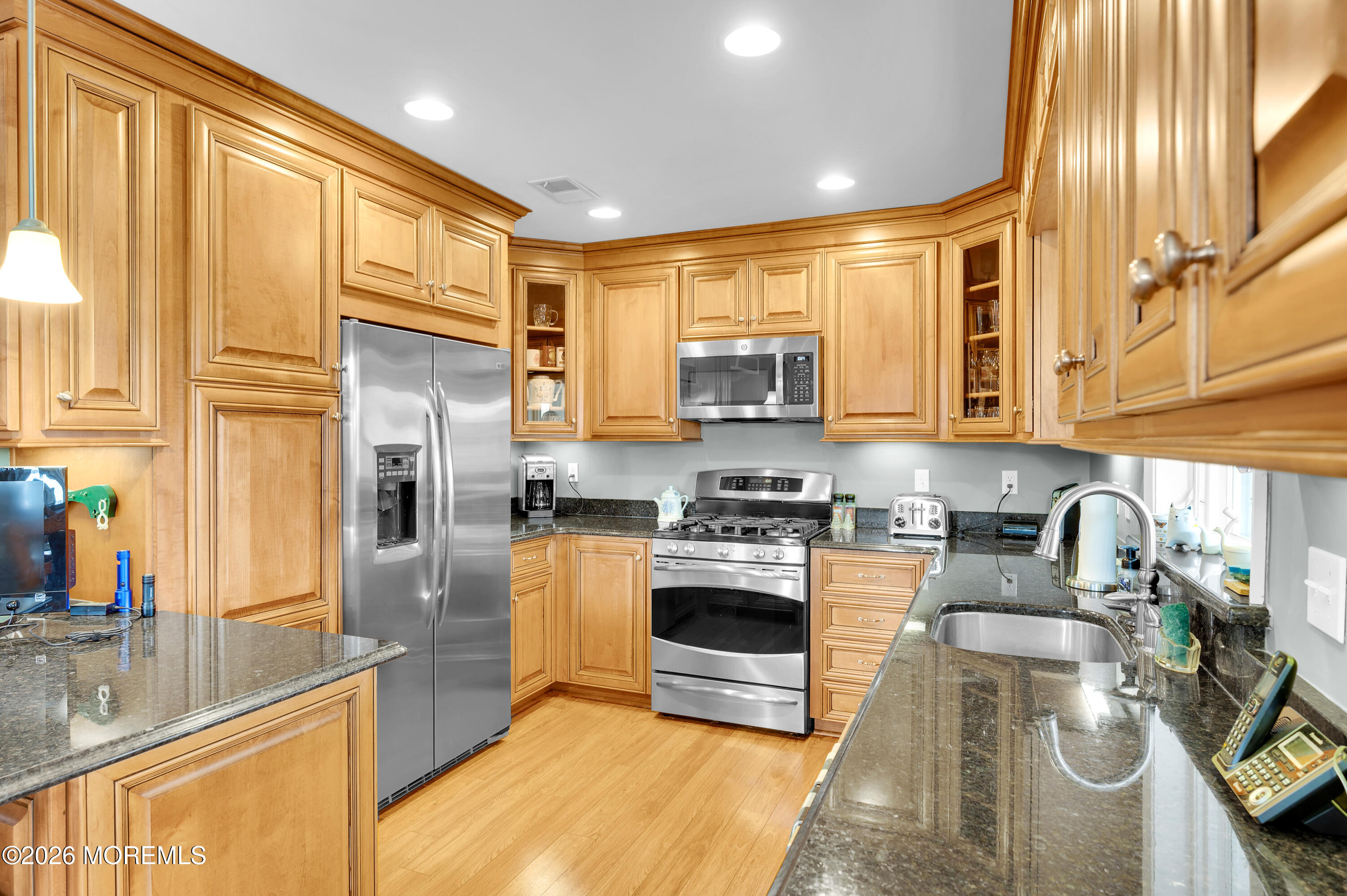 1005 Plimsoll Point Lanoka Harbor, NJ 08734 - Photo 27 of 54 a kitchen with stainless steel appliances granite countertop a stove a sink and a microwave