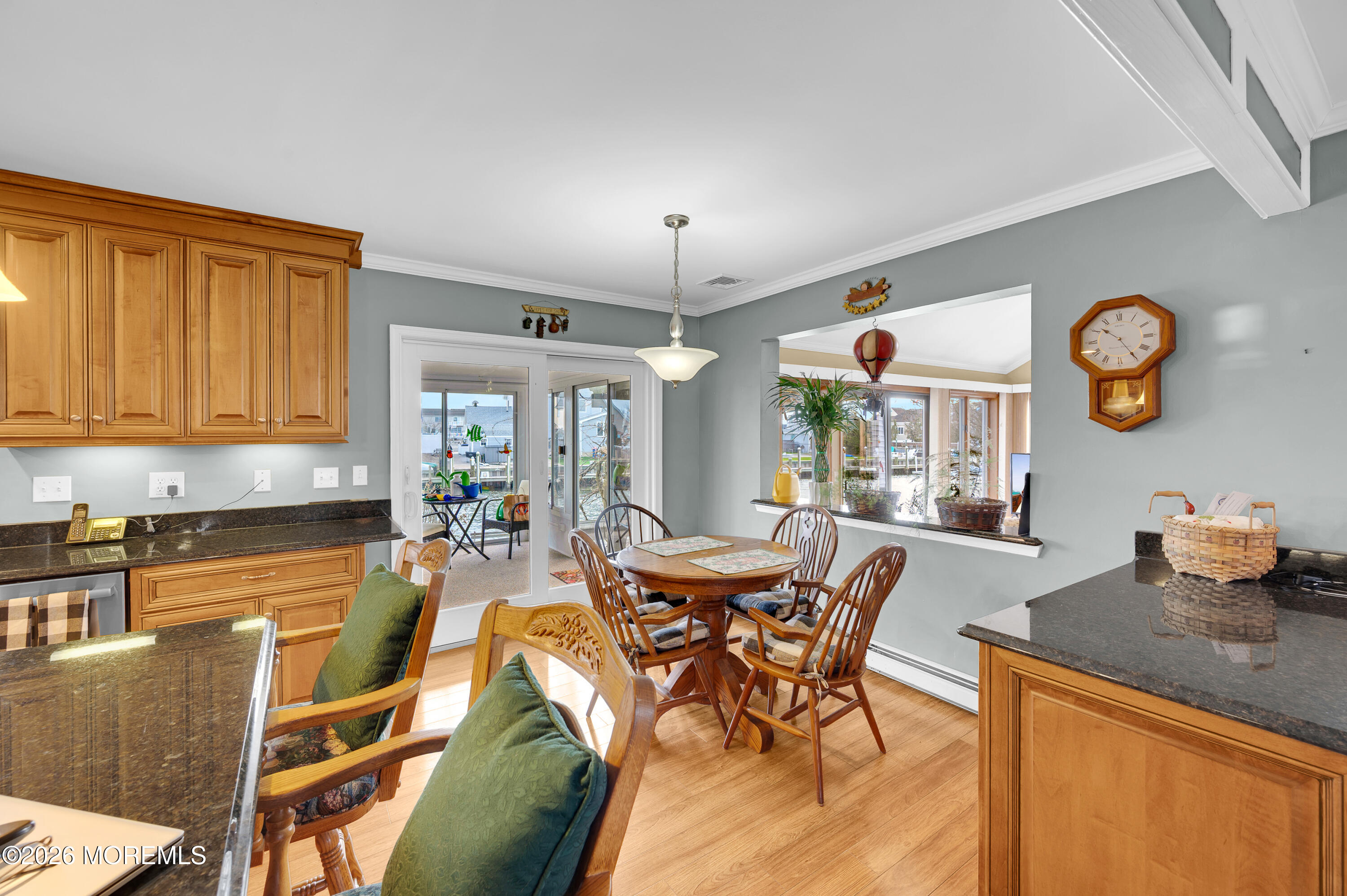 1005 Plimsoll Point Lanoka Harbor, NJ 08734 - Photo 28 of 54 a view of a dining room and livingroom with furniture wooden floor and a clock