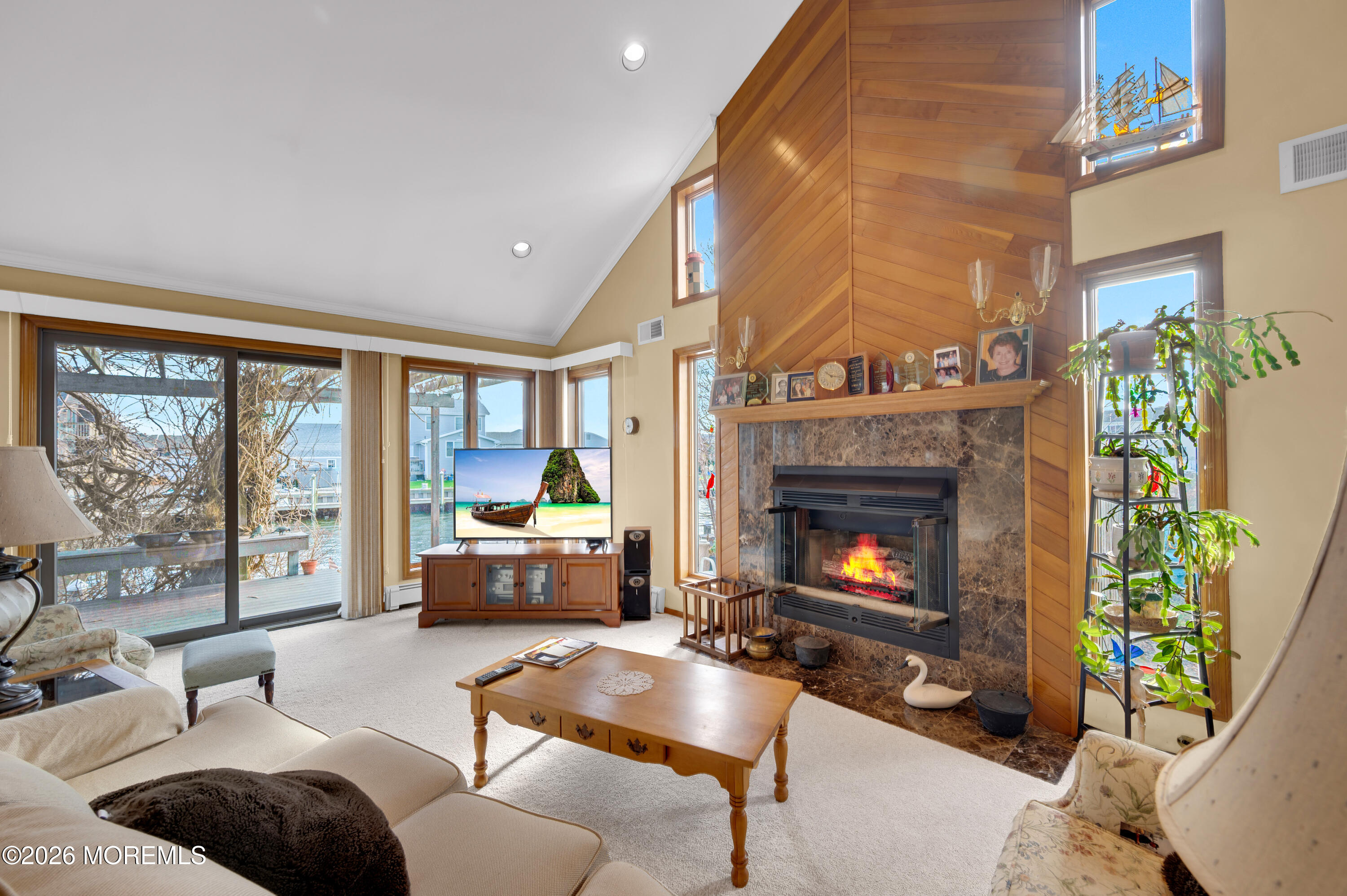 1005 Plimsoll Point Lanoka Harbor, NJ 08734 - Photo 37 of 54 a living room with furniture and a fireplace