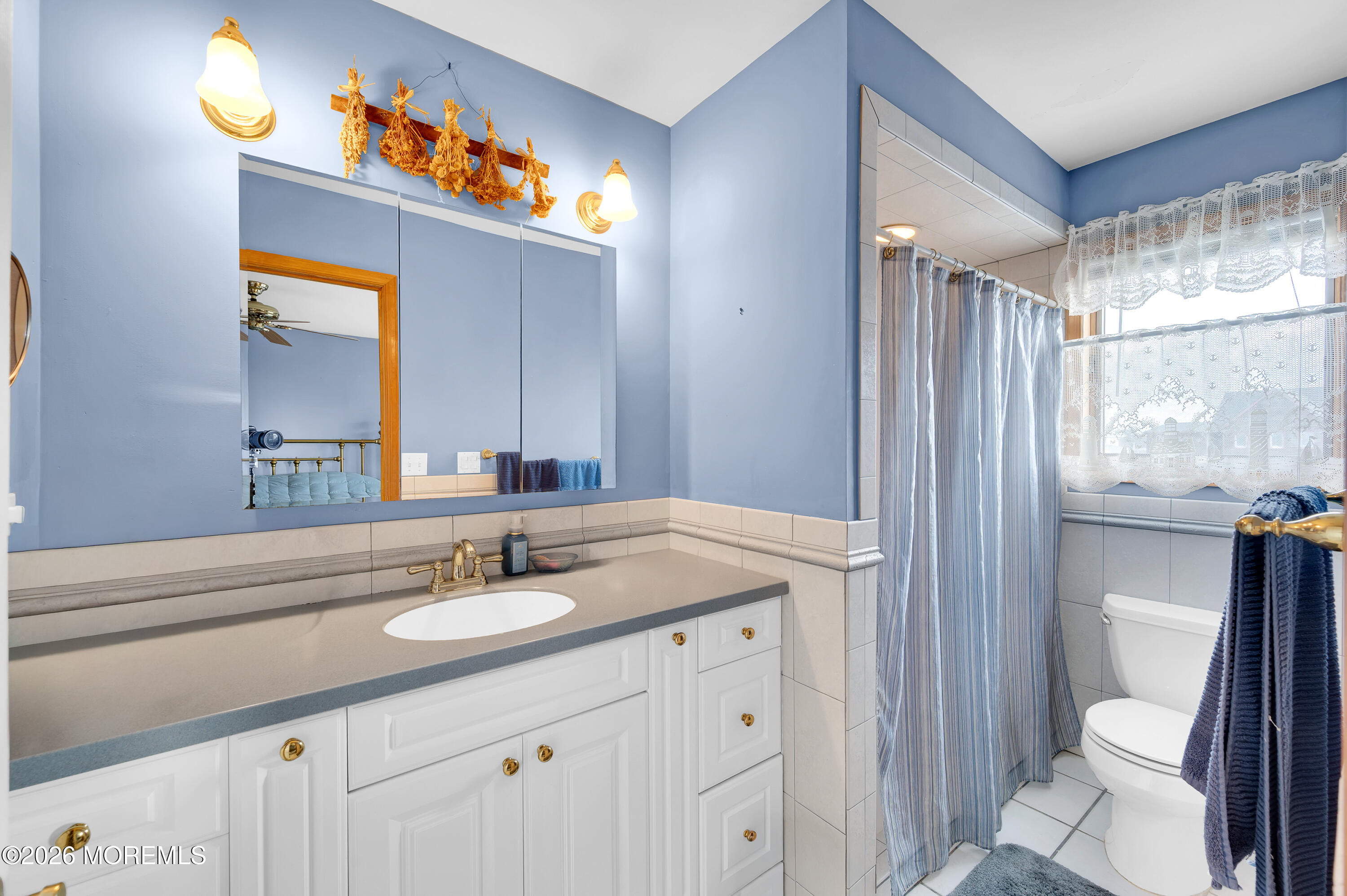 1005 Plimsoll Point Lanoka Harbor, NJ 08734 - Photo 47 of 54 a bathroom with a sink a toilet a mirror a vanity and shower