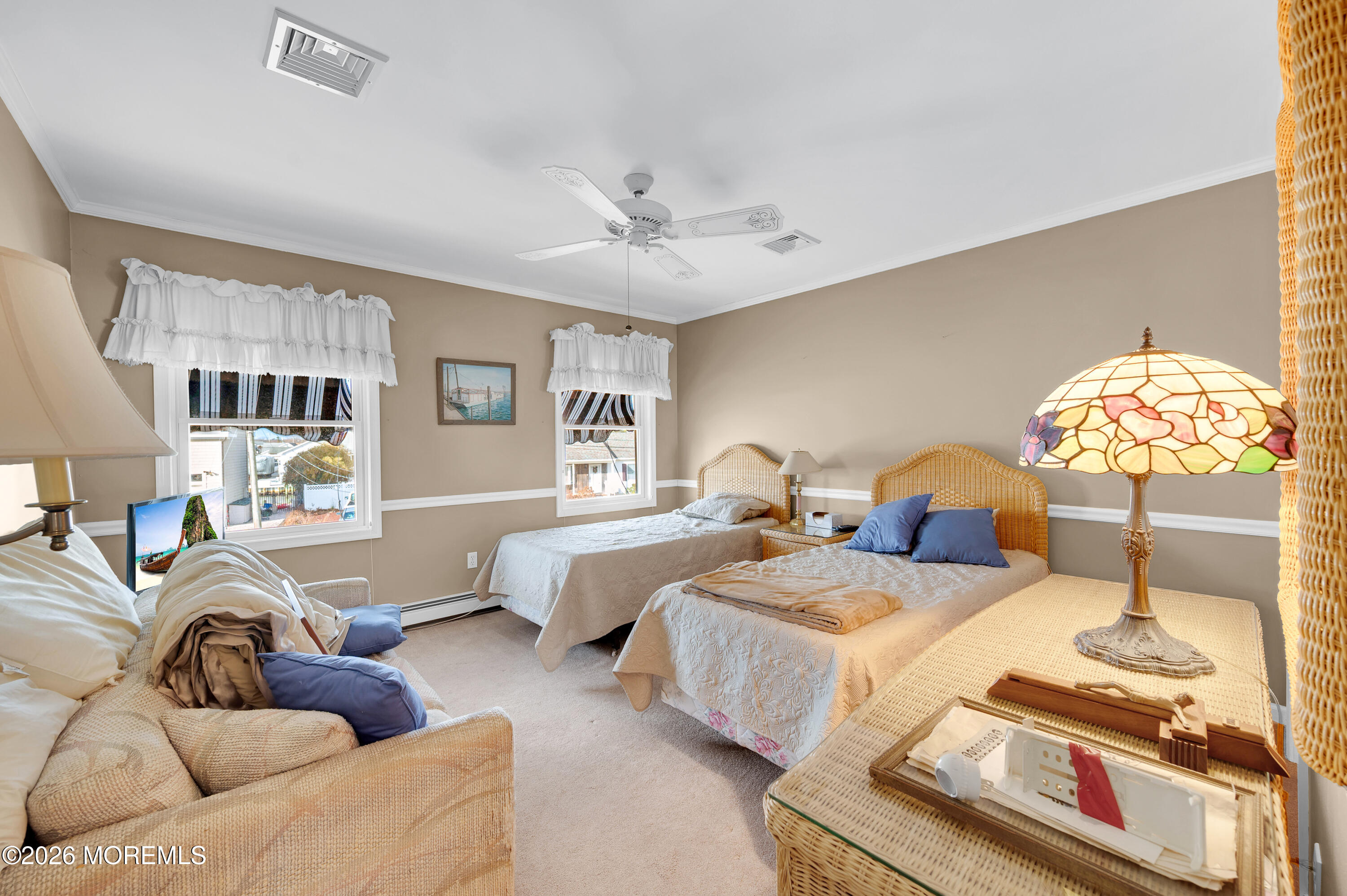 1005 Plimsoll Point Lanoka Harbor, NJ 08734 - Photo 9 of 54 a spacious bedroom with two beds and a chandelier