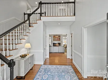 a view of an entryway with wooden floor