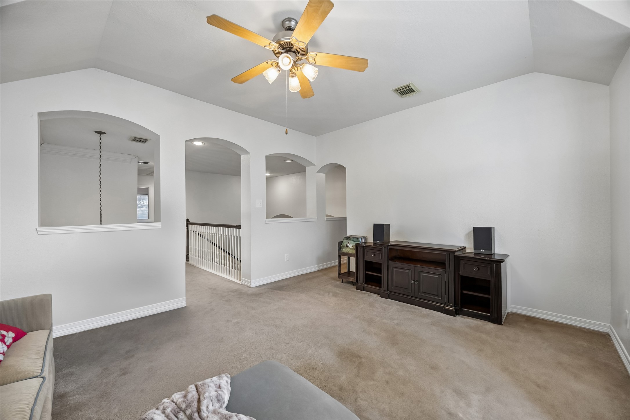 5718 Brennan Ridge Lane Katy, TX 77450 - Photo 24 of 42 ROOM TO GATHER, PLAY, OR RELAX: Tucked away upstairs, this spacious game room offers the perfect setting for movie nights, gaming, homework stations, or a secondary living area.