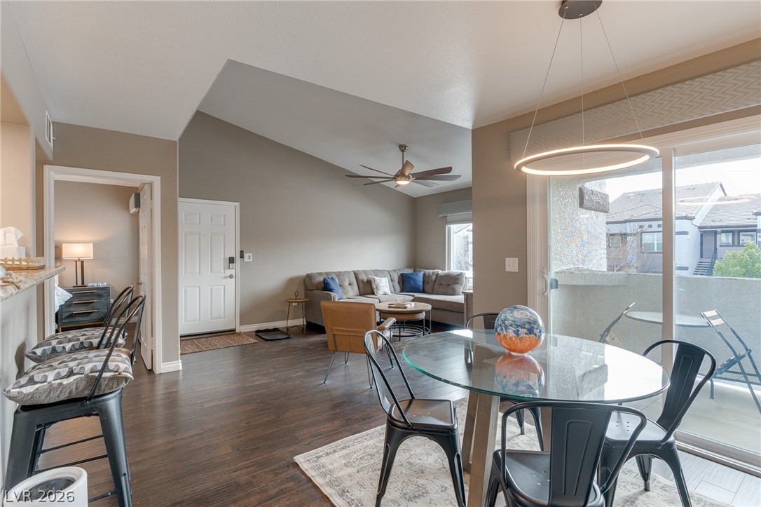 7255 West Sunset Road, Unit 2155 Las Vegas, NV 89113 - Photo 2 of 21 Dining area with dark wood-type flooring, vaulted ceiling, and a ceiling fan