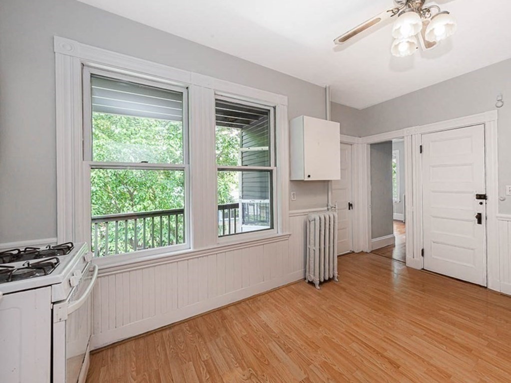 33 Stanton Road, Unit 2 Brookline, MA 02445 - Photo 11 of 19 a view of empty room with wooden floor and fan