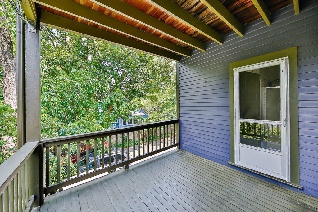 33 Stanton Road, Unit 2 Brookline, MA 02445 - Photo 12 of 19 a view of a balcony with wooden floor
