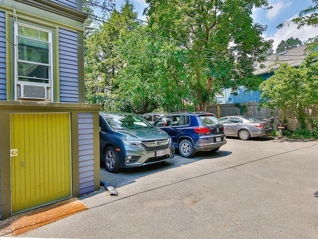 33 Stanton Road, Unit 2 Brookline, MA 02445 - Photo 18 of 19 a view of a cars parked in front of a house