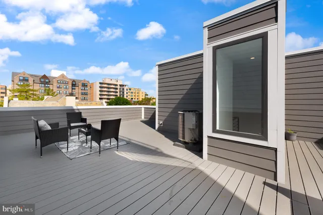 a view of a car parked in front of a house