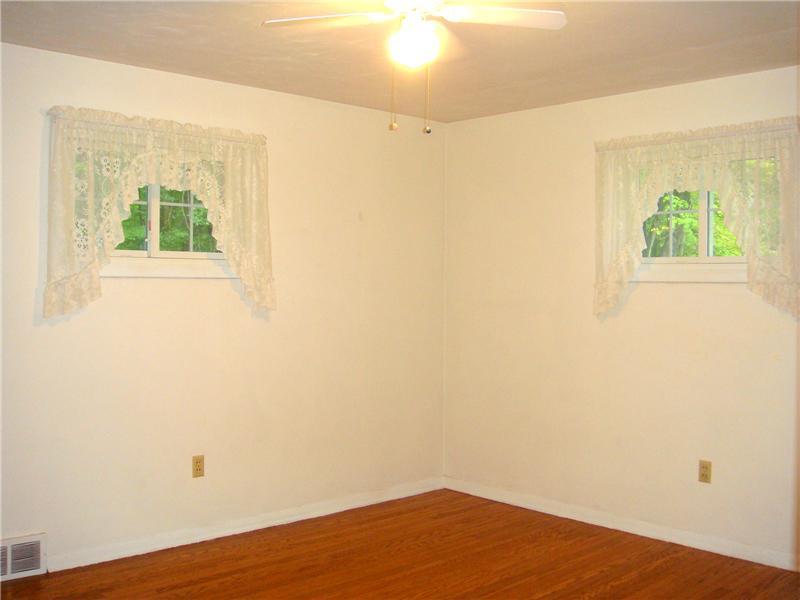 879 Clarksville Road Hermitage, PA 16148 - Photo 6 of 20 Bedroom. Bedroom with Beautiful Hardwood Floors & Newer Windows