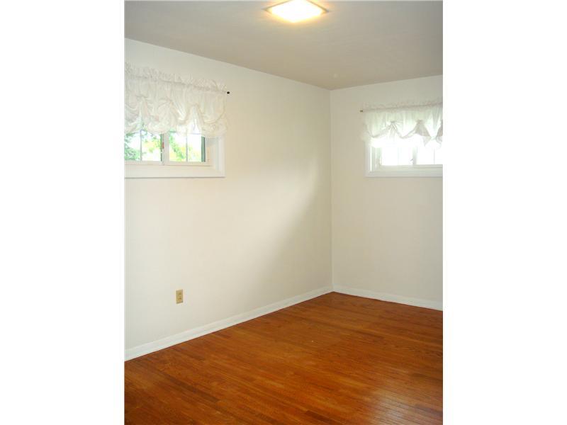 879 Clarksville Road Hermitage, PA 16148 - Photo 7 of 20 Bedroom. Bedroom 2 w/ Hardwood and Newer Windows