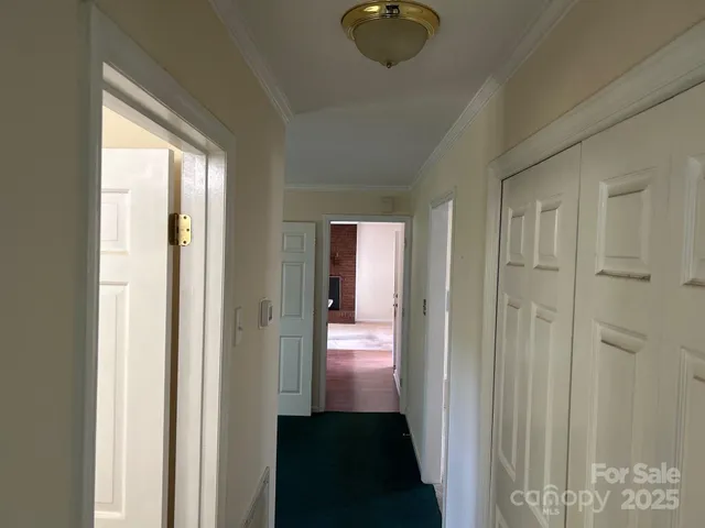 a view of a livingroom from a hallway