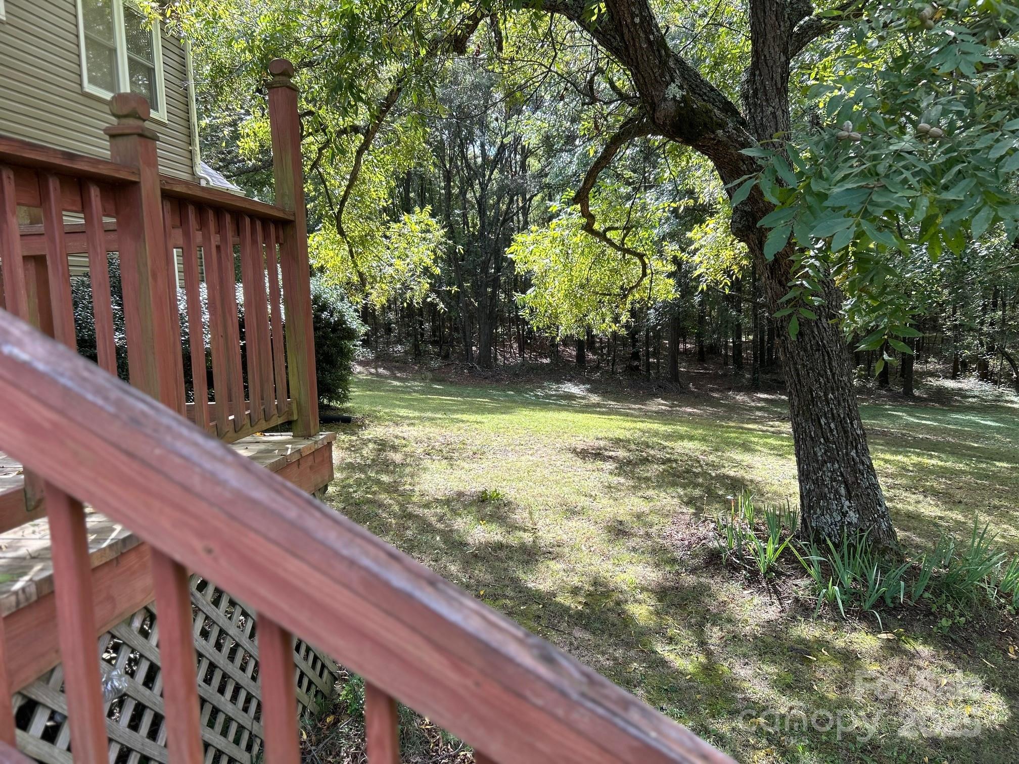 9025 Sorrow Farm Road Kannapolis, NC 28081 - Photo 20 of 21 a view of a yard with large trees