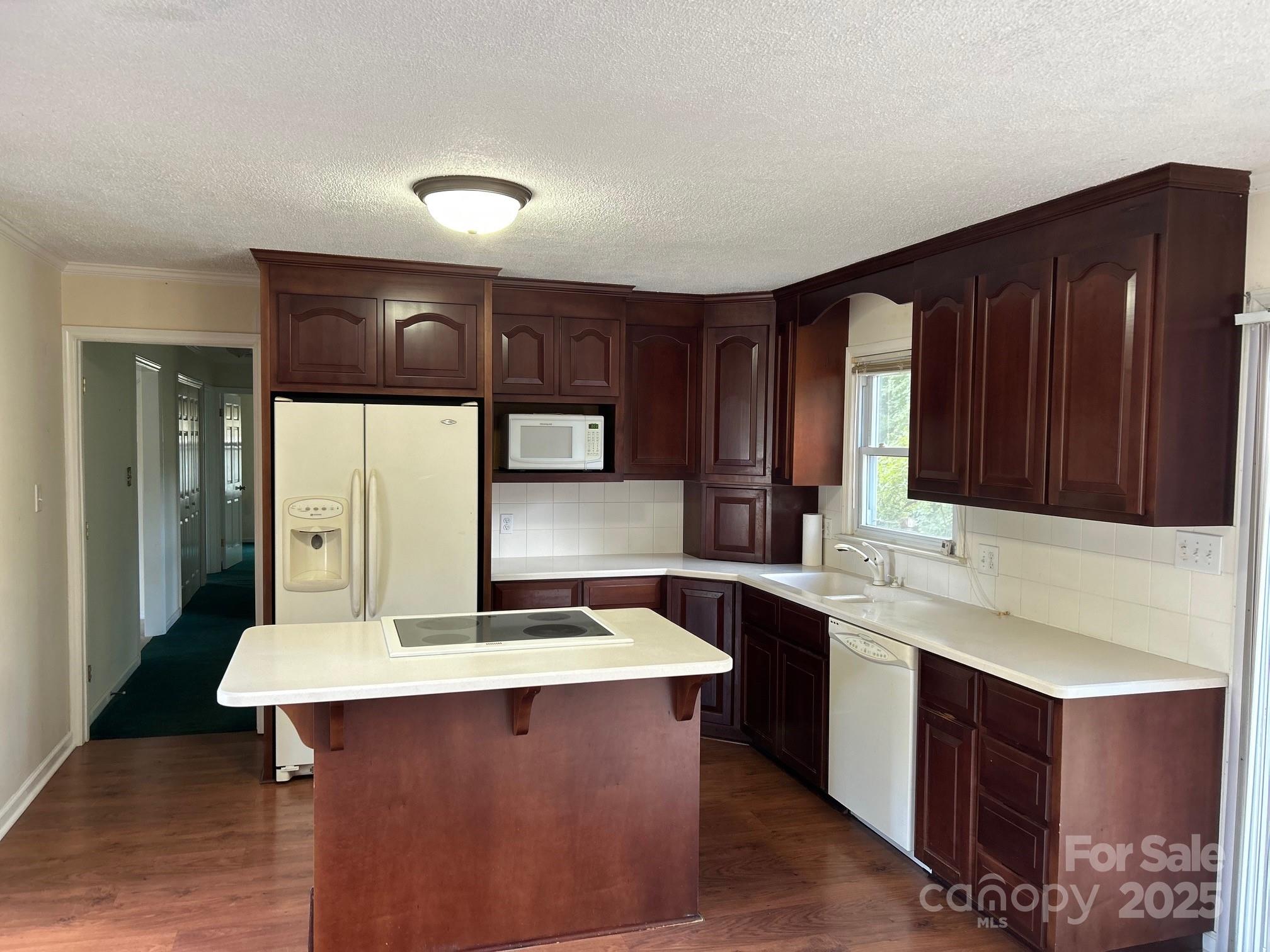 9025 Sorrow Farm Road Kannapolis, NC 28081 - Photo 5 of 21 a kitchen with a sink cabinets and wooden floor