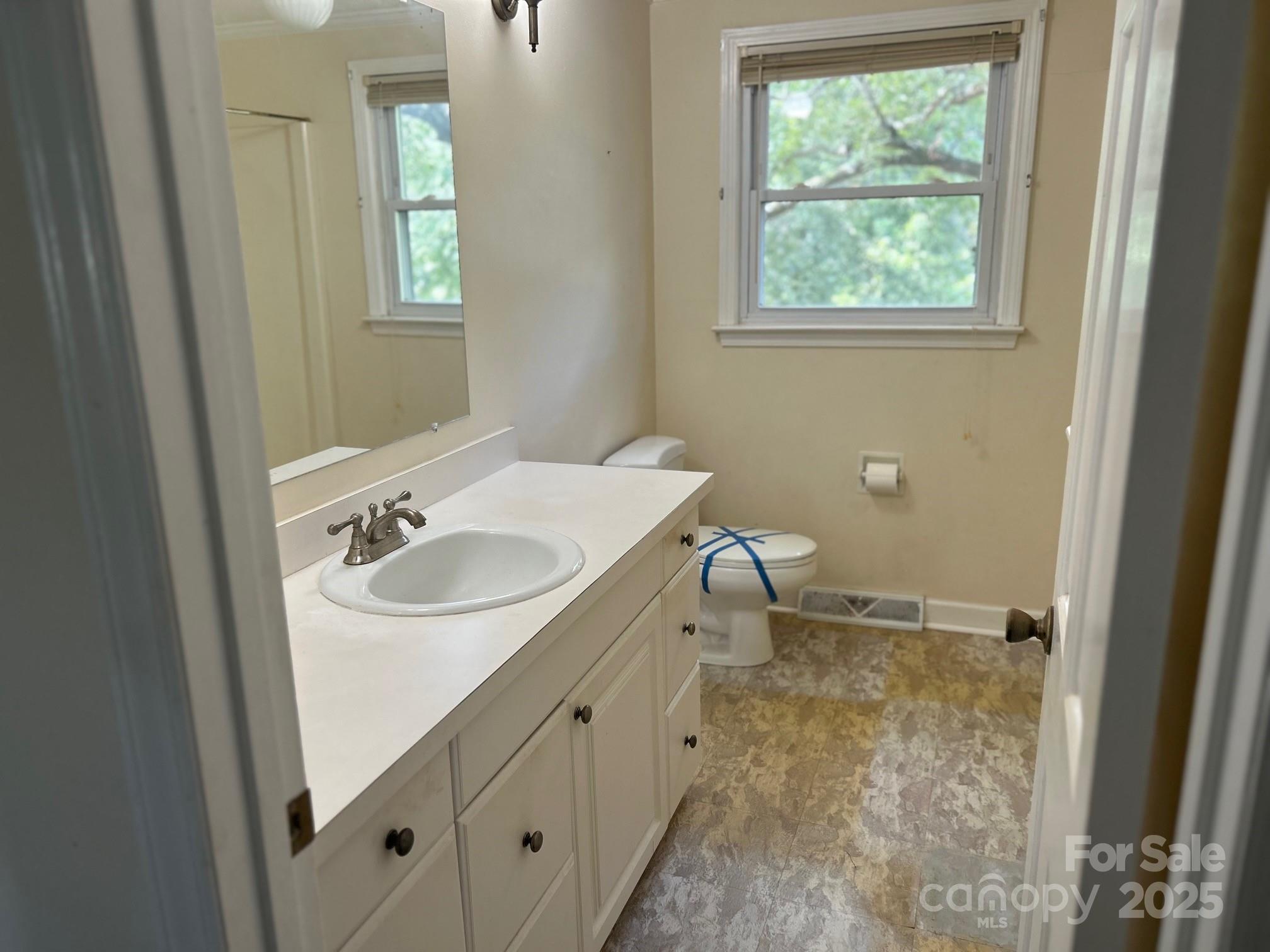 9025 Sorrow Farm Road Kannapolis, NC 28081 - Photo 9 of 21 a bathroom with a sink toilet and a window