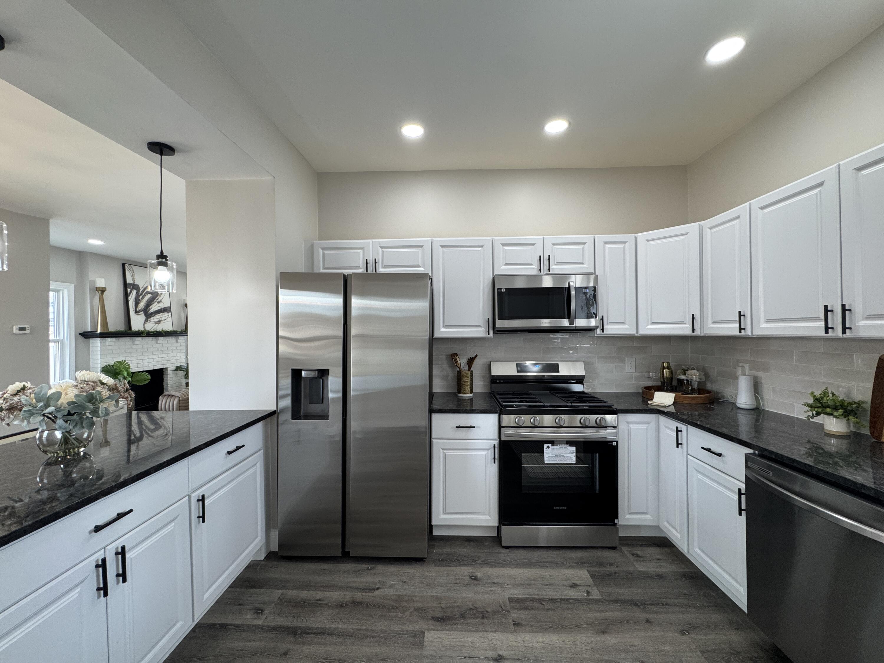 800 Buchanan Street Gary, IN 46402 - Photo 13 of 29 a kitchen with stainless steel appliances granite countertop a stove a sink and a refrigerator