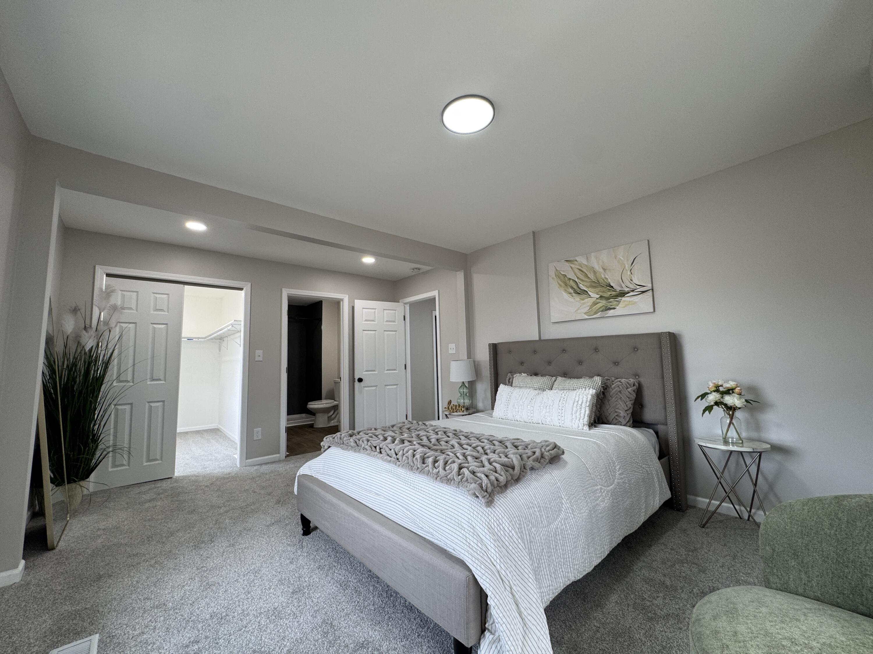 800 Buchanan Street Gary, IN 46402 - Photo 18 of 29 a bedroom with a large bed and a couch