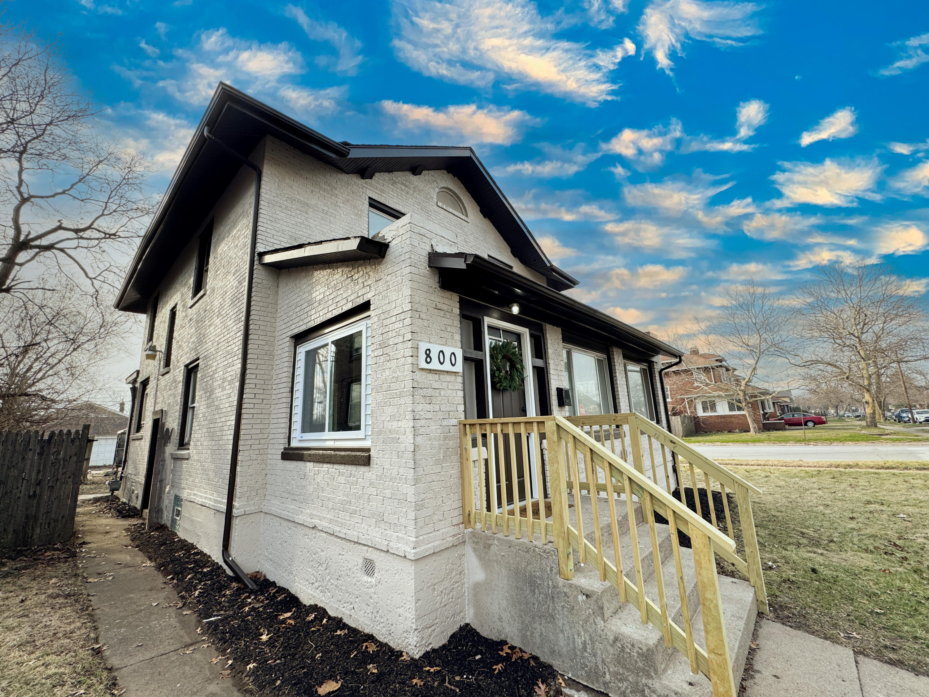 800 Buchanan Street Gary, IN 46402 - Photo 2 of 29 a front view of a house with a yard